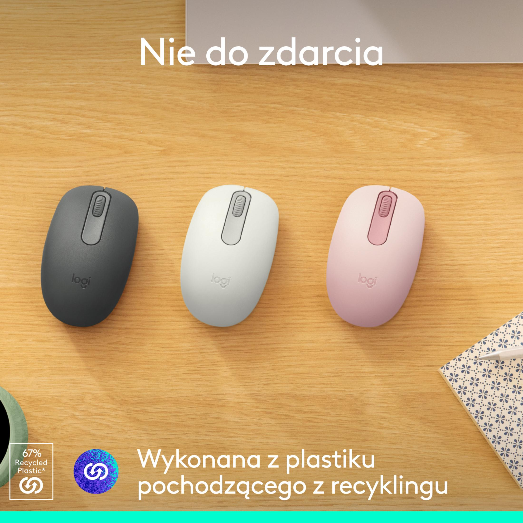 Three Logitech mice in gray, white, and pink on a wooden surface, with recycling information.