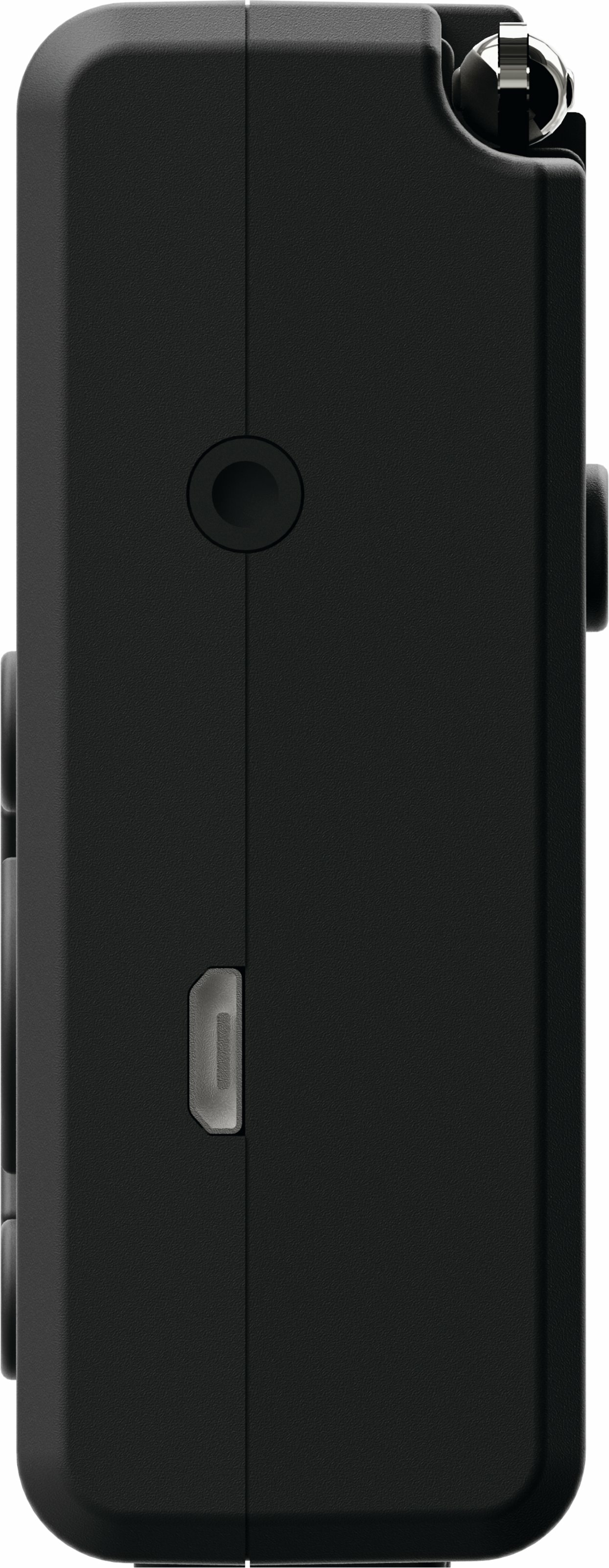 Zbliżenie czarnego prostokątnego urządzenia z gniazdem słuchawkowym, portem ładowania i metalową anteną.