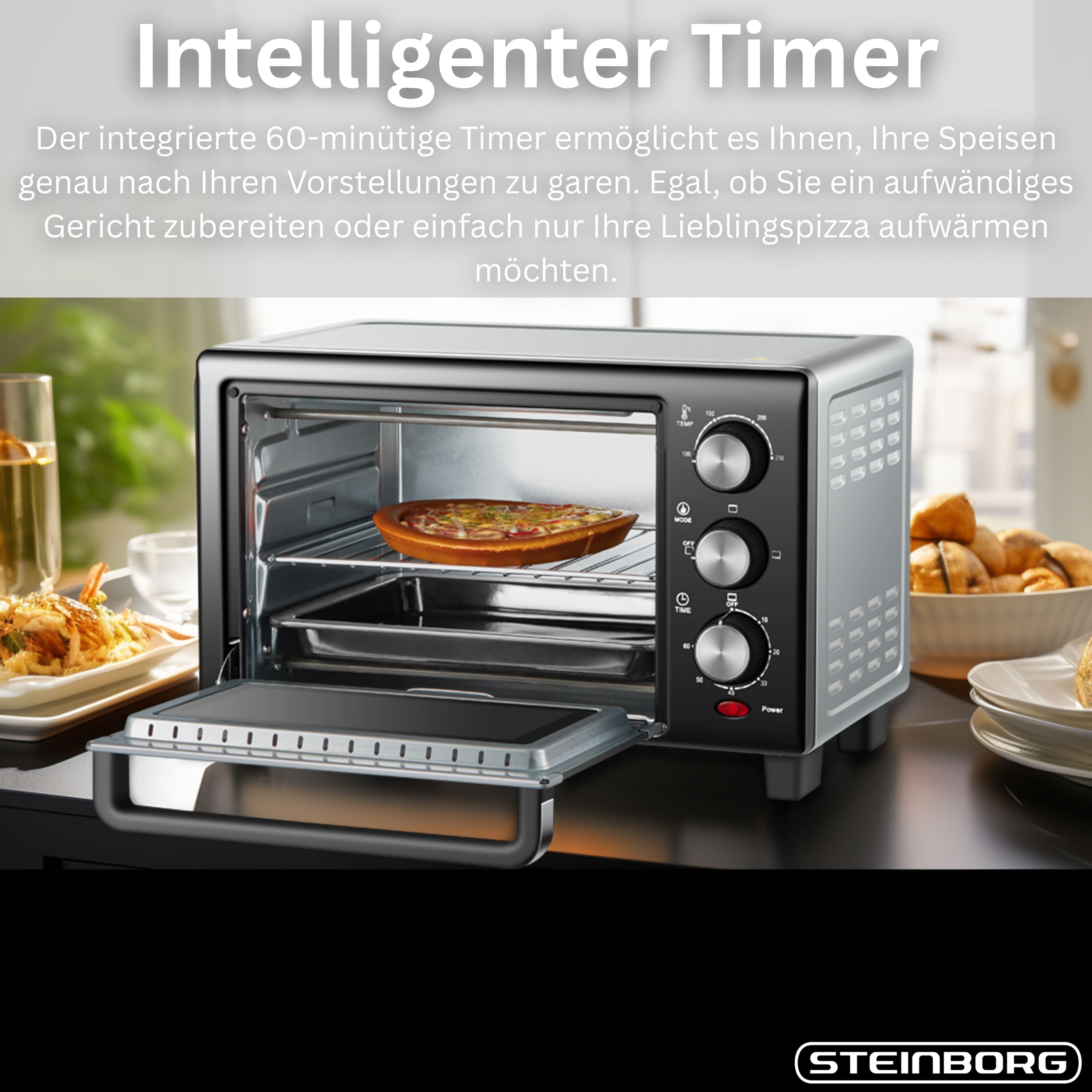 Ein schwarzer und silberner Tischbackofen mit Pizza, offener Tür und Essen daneben.