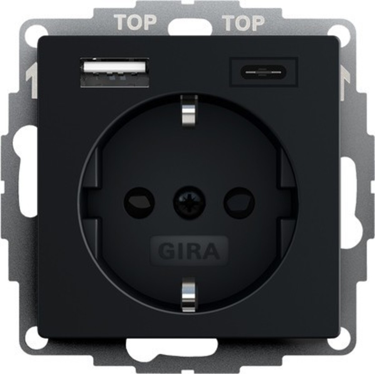Eine schwarze GIRA-Steckdose mit USB- und USB-C-Anschlüssen. Sie hat eine runde Steckdose, einen USB-Anschluss und einen USB-C-Anschluss.