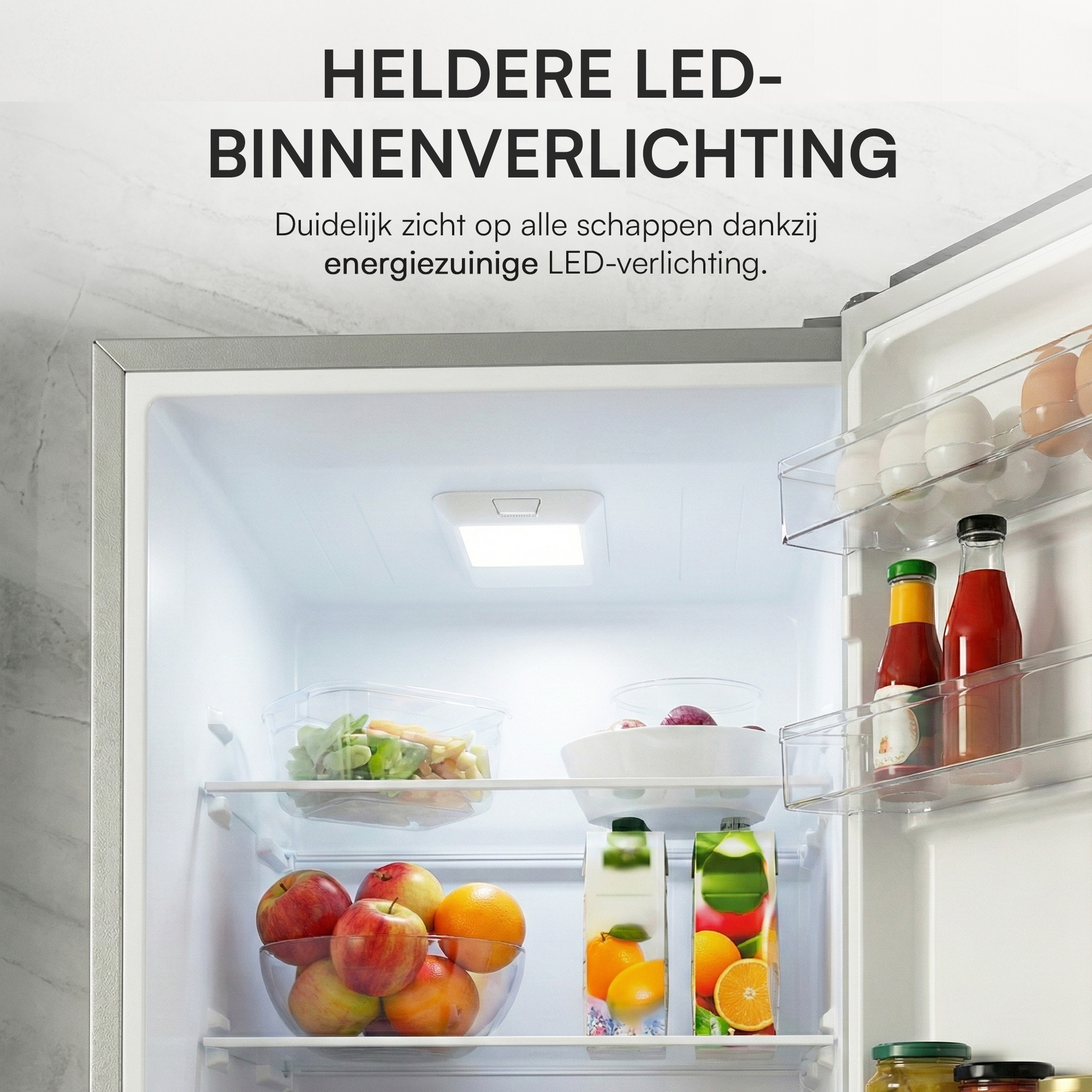 Open refrigerator with fruits, juice, and vegetables. Bright LED light illuminates the contents.