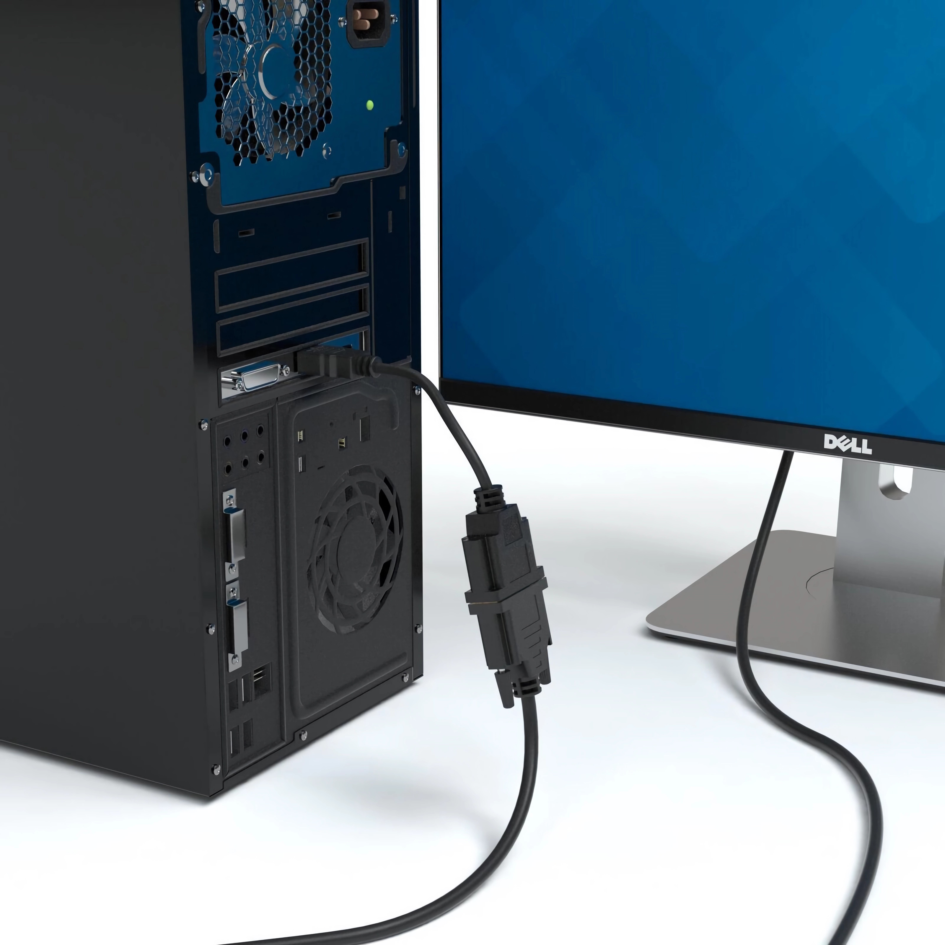 Ein Computer-Tower mit Kabel an einem Monitor. Rechts ist ein Dell-Monitor.