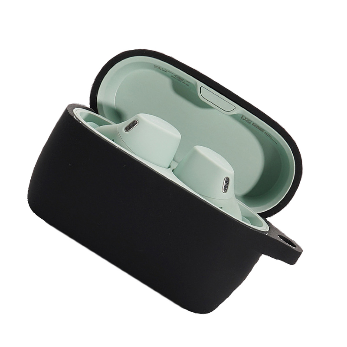 Otwarty czarny futerał z miętowo-zielonymi słuchawkami w środku. Futerał otwarty, widać słuchawki i wnętrze.