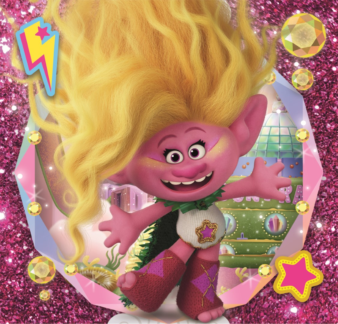 Różowy Troll z żółtymi włosami i zieloną peleryną uśmiecha się z otwartymi ramionami. Tło jest błyszczące z klejnotami i budynkiem.