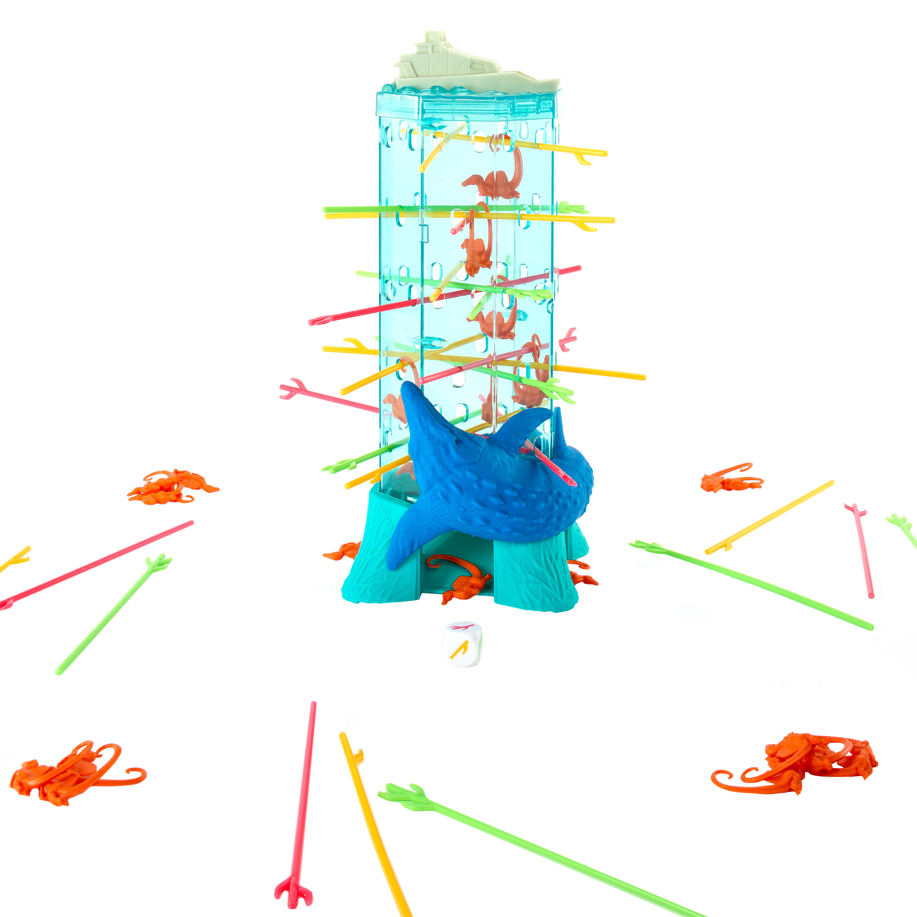 Un jeu sur le thème du requin avec des bâtons colorés, des singes oranges et un dé. Le jeu est sur fond blanc.