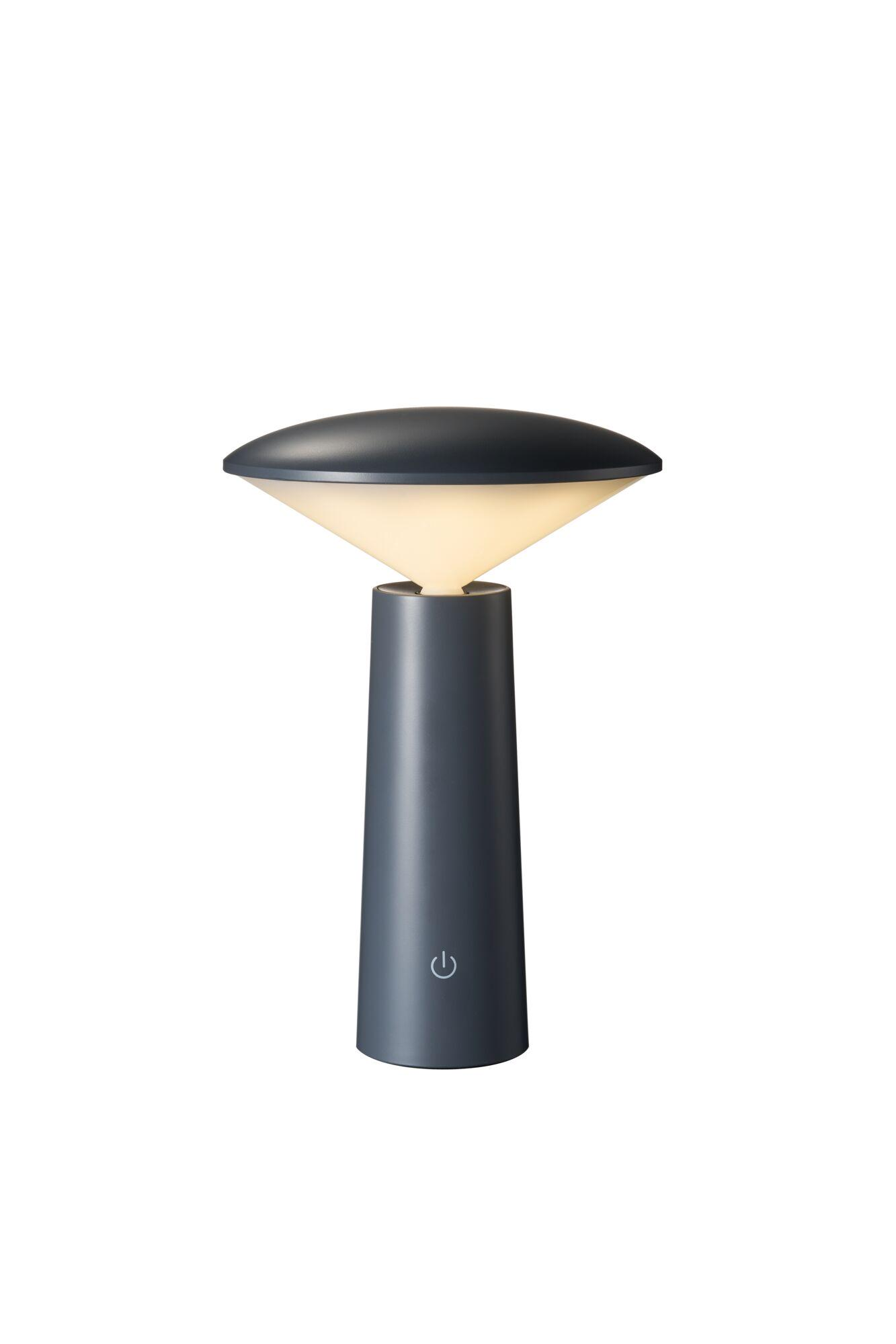 Nowoczesna, ciemnoszara lampa stołowa. Posiada zaokrąglony klosz i cylindryczną podstawę z przyciskiem zasilania.
