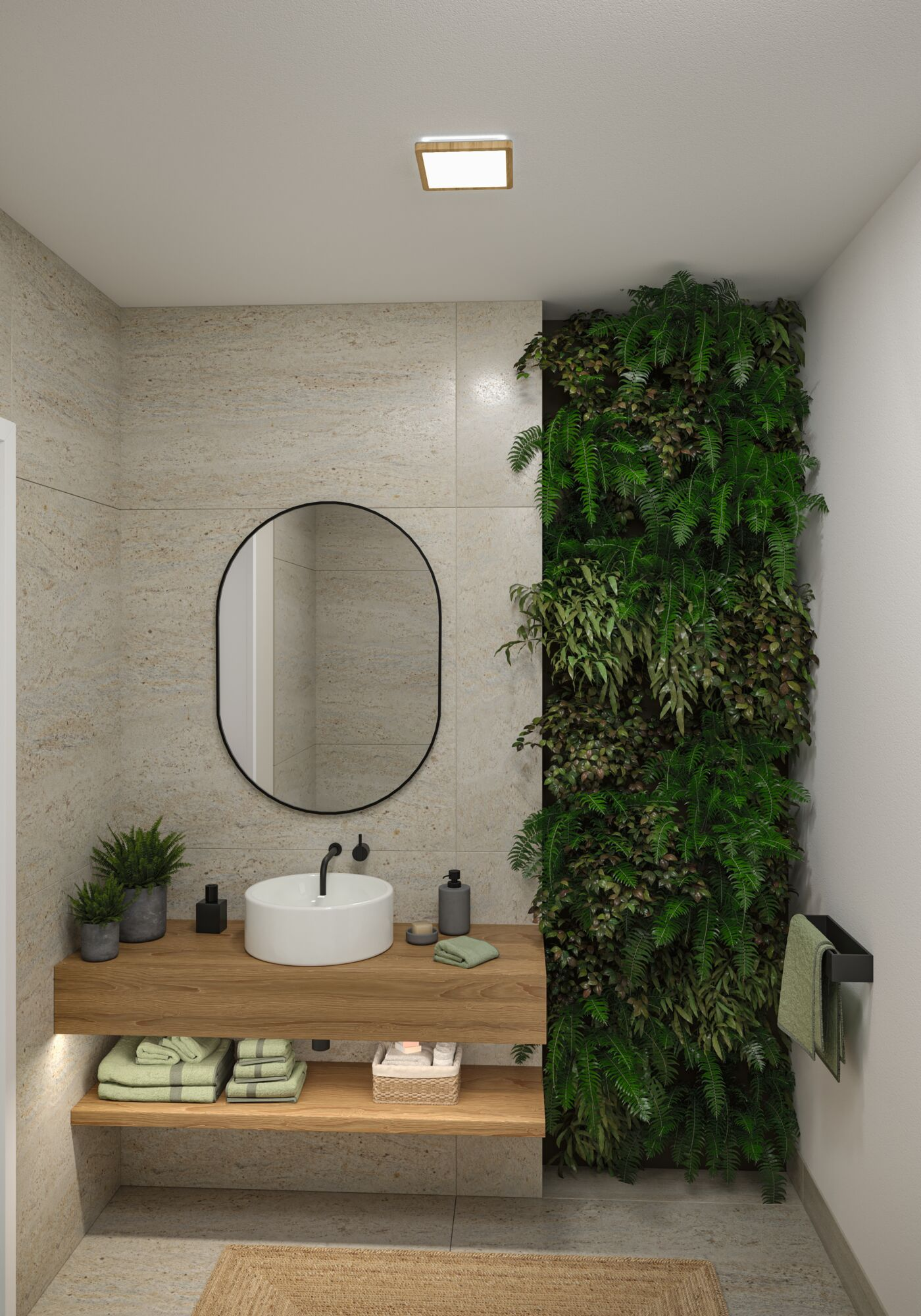 Łazienka ze ścianą roślinną, drewnianym blatem, owalnym lustrem i białą umywalką. Ręczniki i rośliny na blacie.