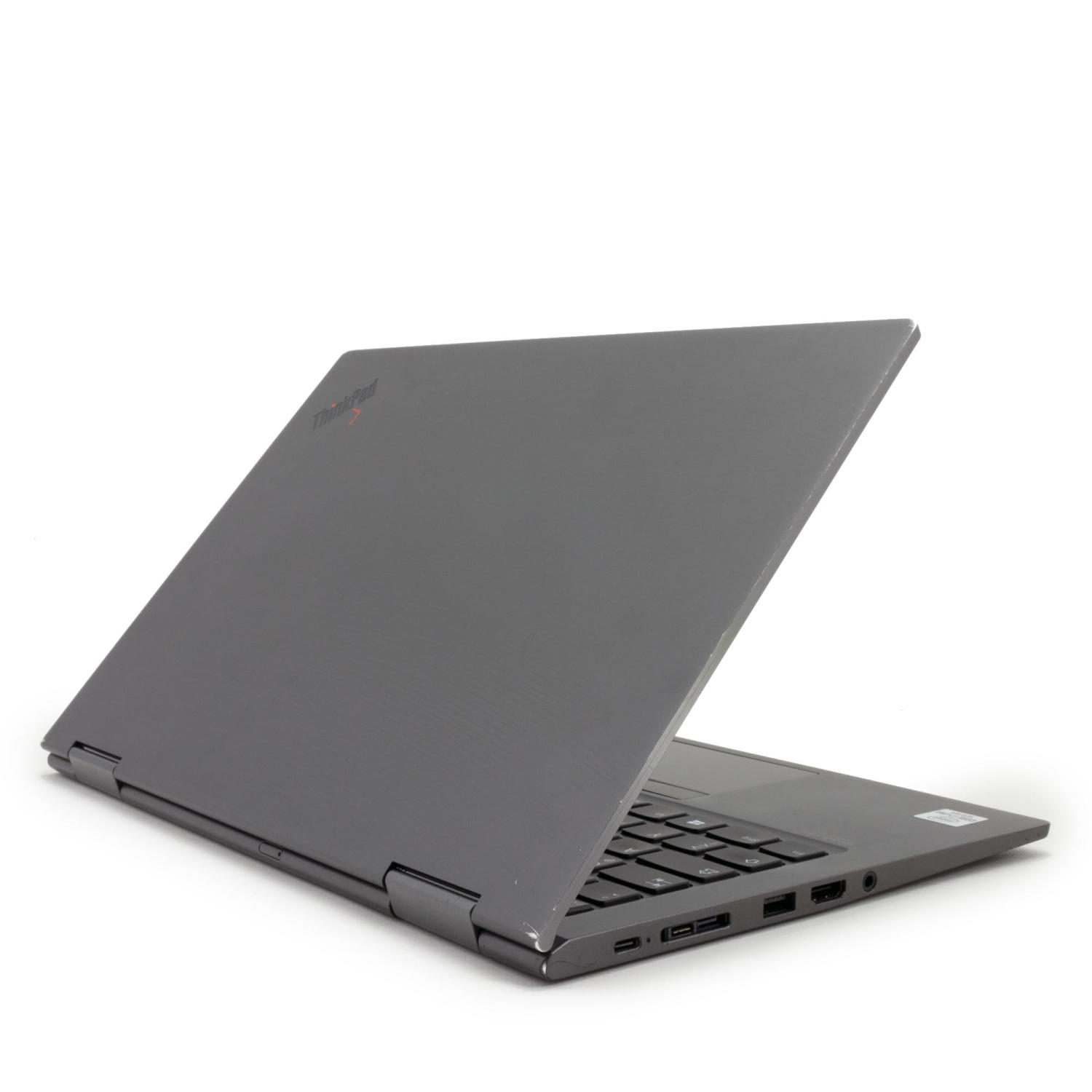 Ein grauer ThinkPad-Laptop ist teilweise geöffnet und zeigt die Tastatur und Anschlüsse. Der Hintergrund ist weiß.