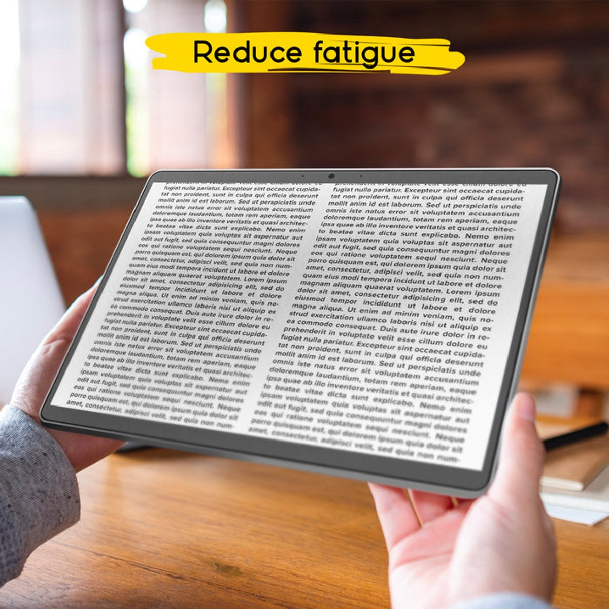 Manos sostienen una tableta con texto. Un banner amarillo dice 'Reduce fatigue'.