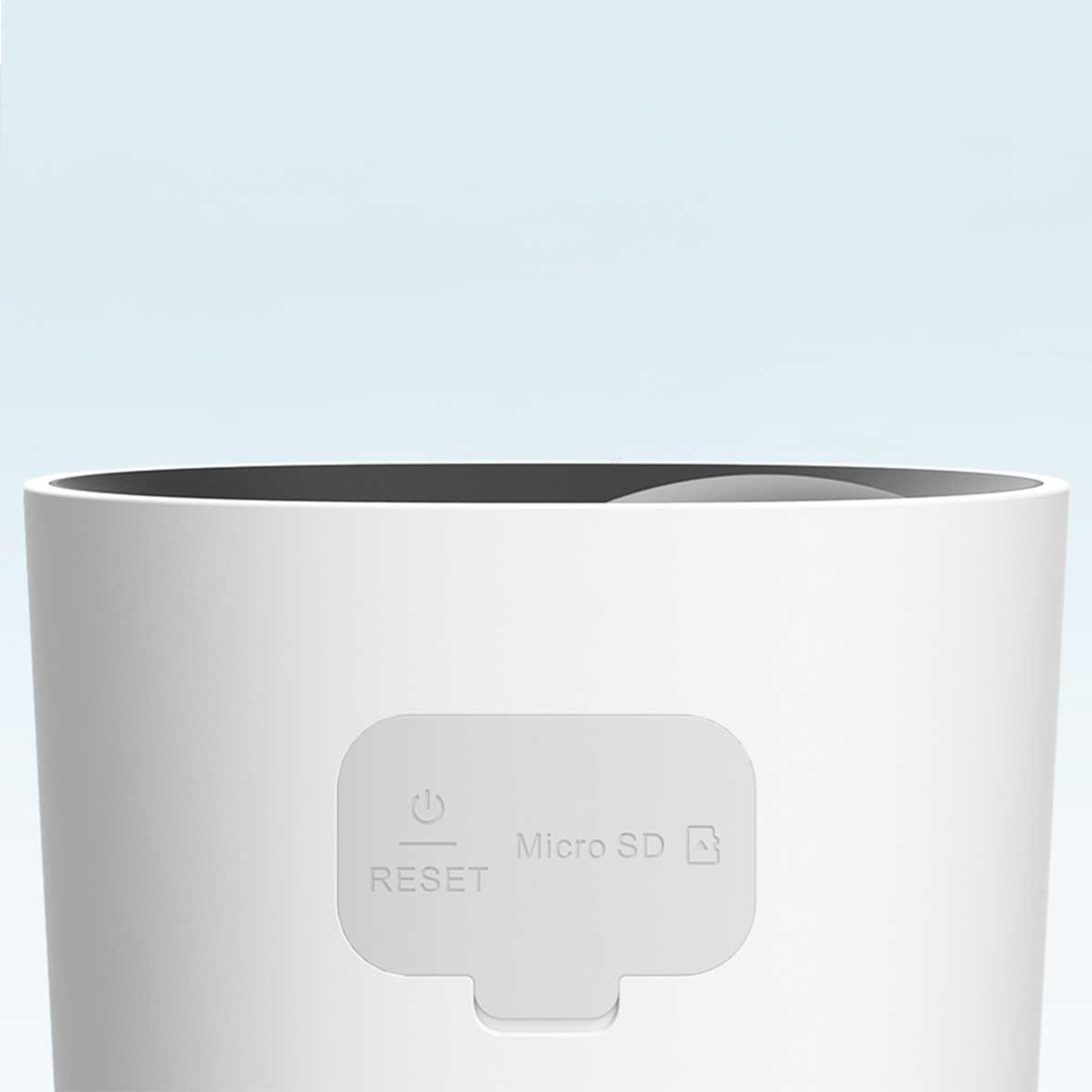 Biały cylinder z szarym panelem. Panel ma symbol zasilania, tekst 'RESET', 'Micro SD' i ikonę karty.