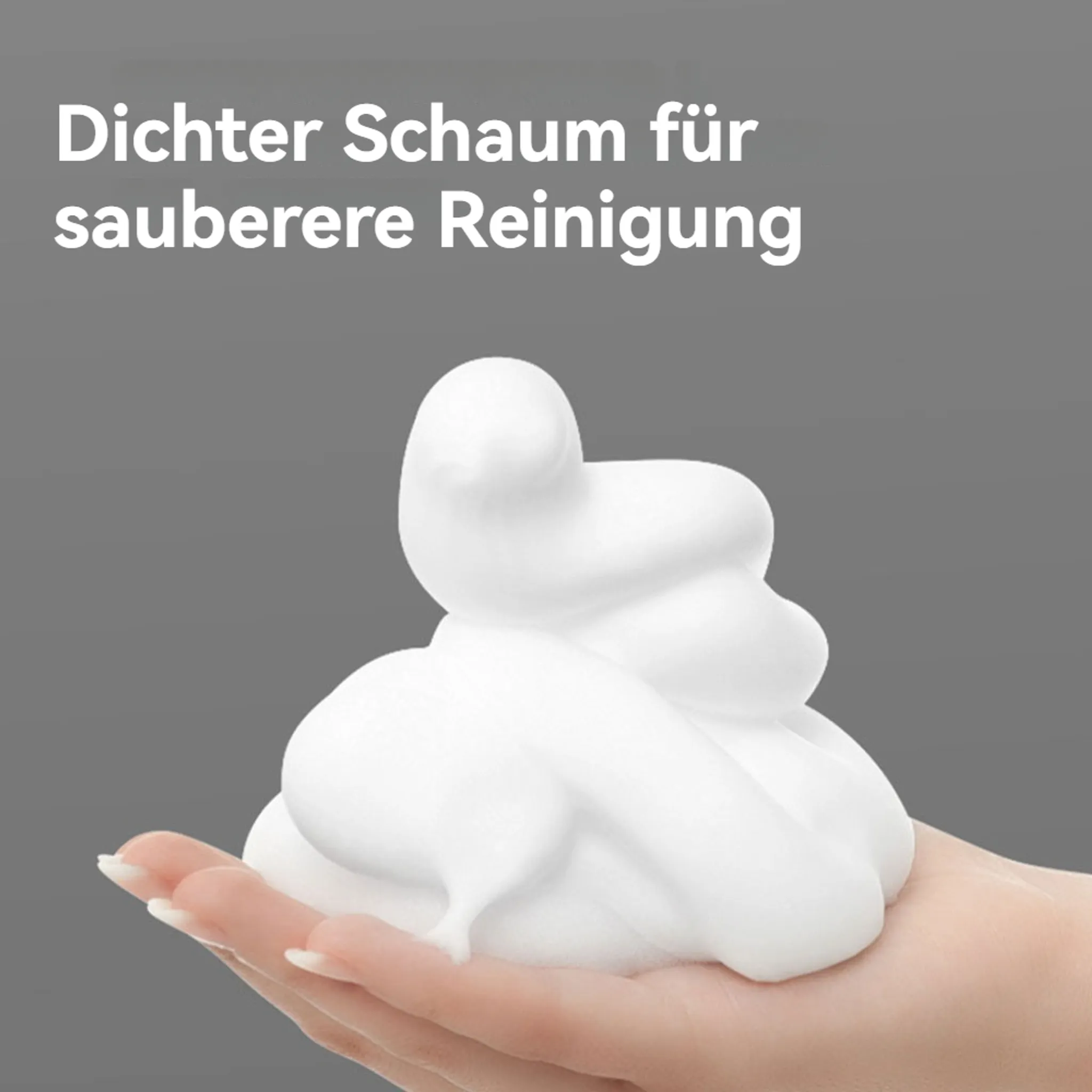 Eine Hand, die einen großen Haufen weißen Schaums hält, mit Text darüber. Der Schaum ist vor einem grauen Hintergrund.