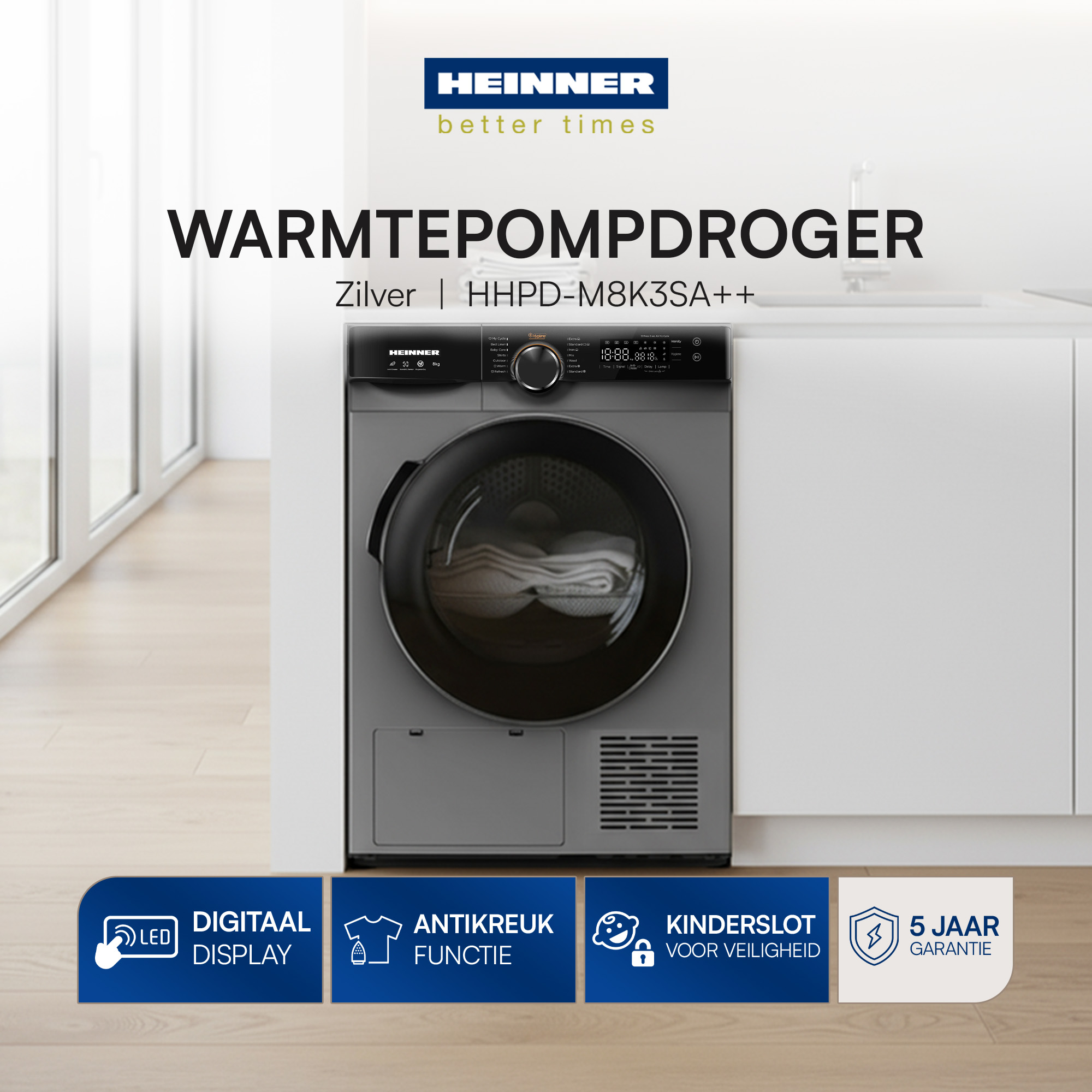 A silver heat pump dryer with digital display, anti-crease function, child lock, and 5-year warranty.