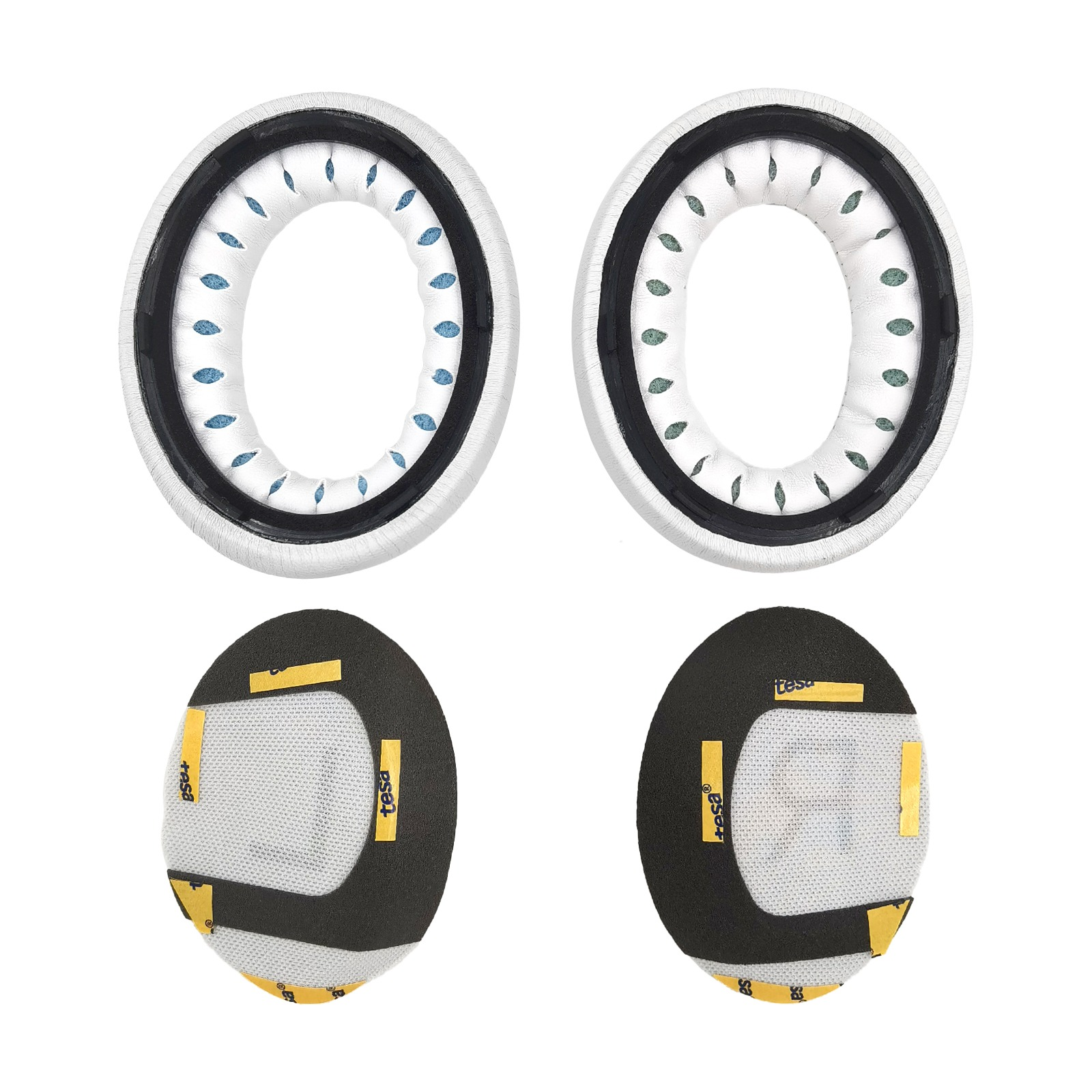 Cztery nauszniki do słuchawek. Dwa są okrągłe w kolorze białym i czarnym, a dwa owalne w kolorze czarnym, białym i żółtym.