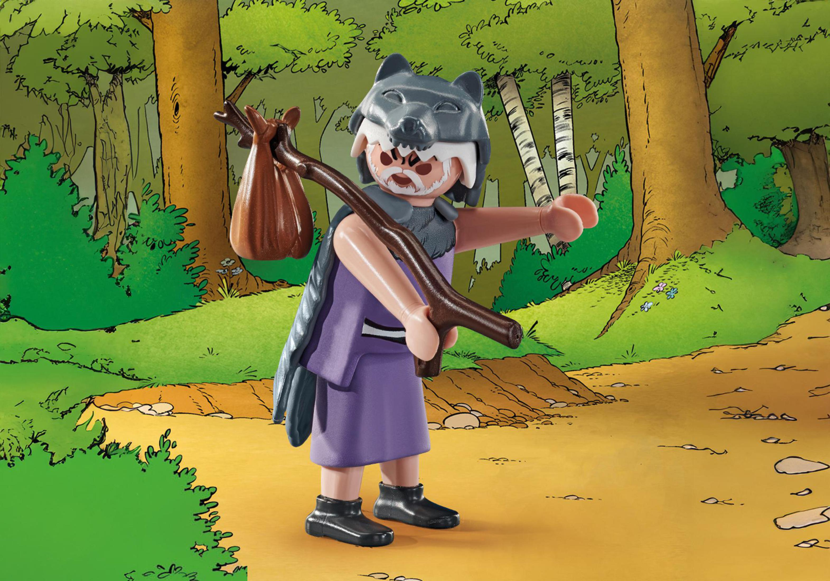 A figure in wolf headdress carries a stick and bag in a forest setting with trees and a path.