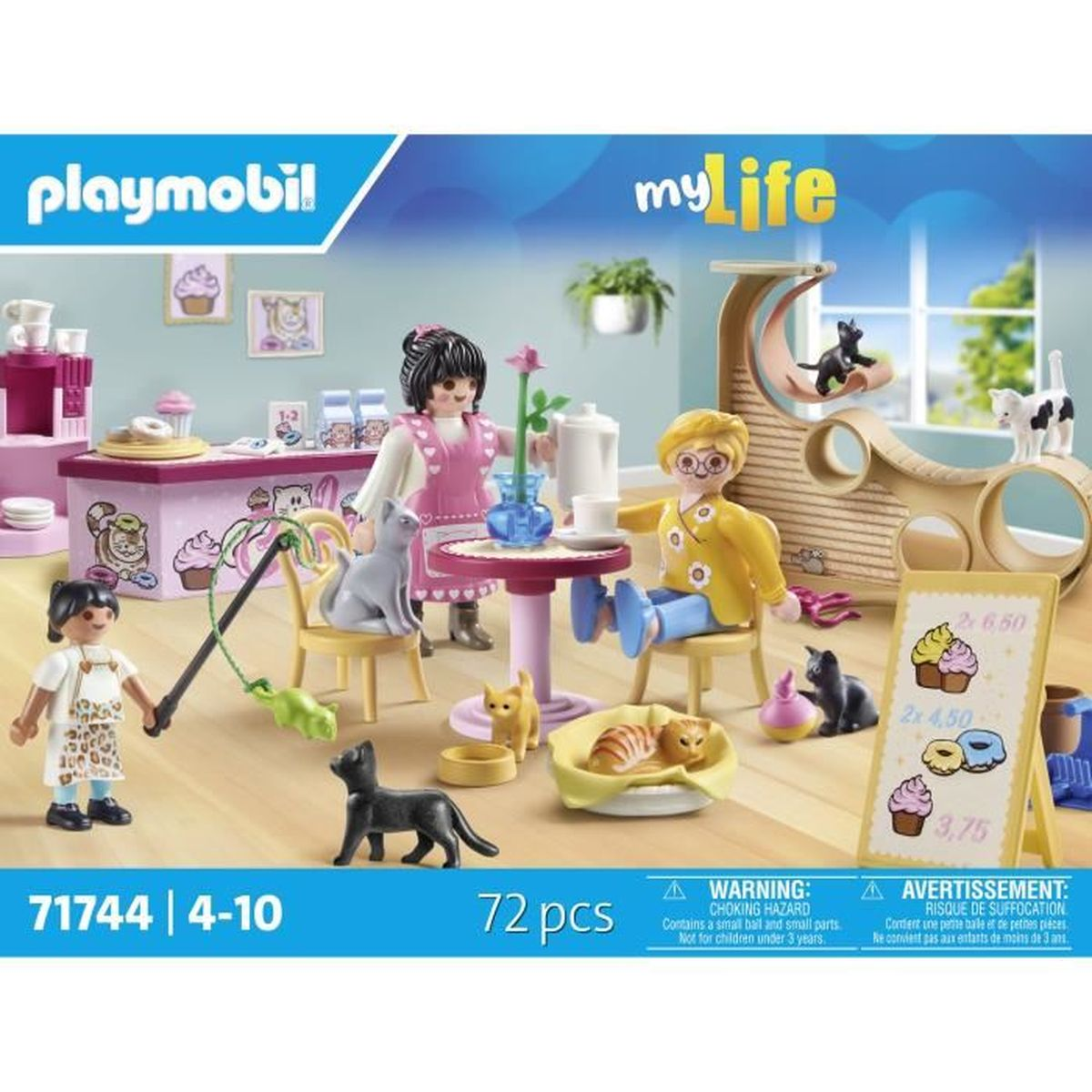 Set de Playmobil con figuras, gatos y muebles. La escena incluye una encimera de cafetería, mesa, árbol para gatos y un tablero de precios.