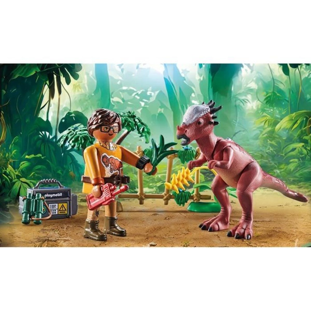 Una figura de Playmobil con una camisa naranja con un dinosaurio. Fondo de jungla. También hay una radio y binoculares.