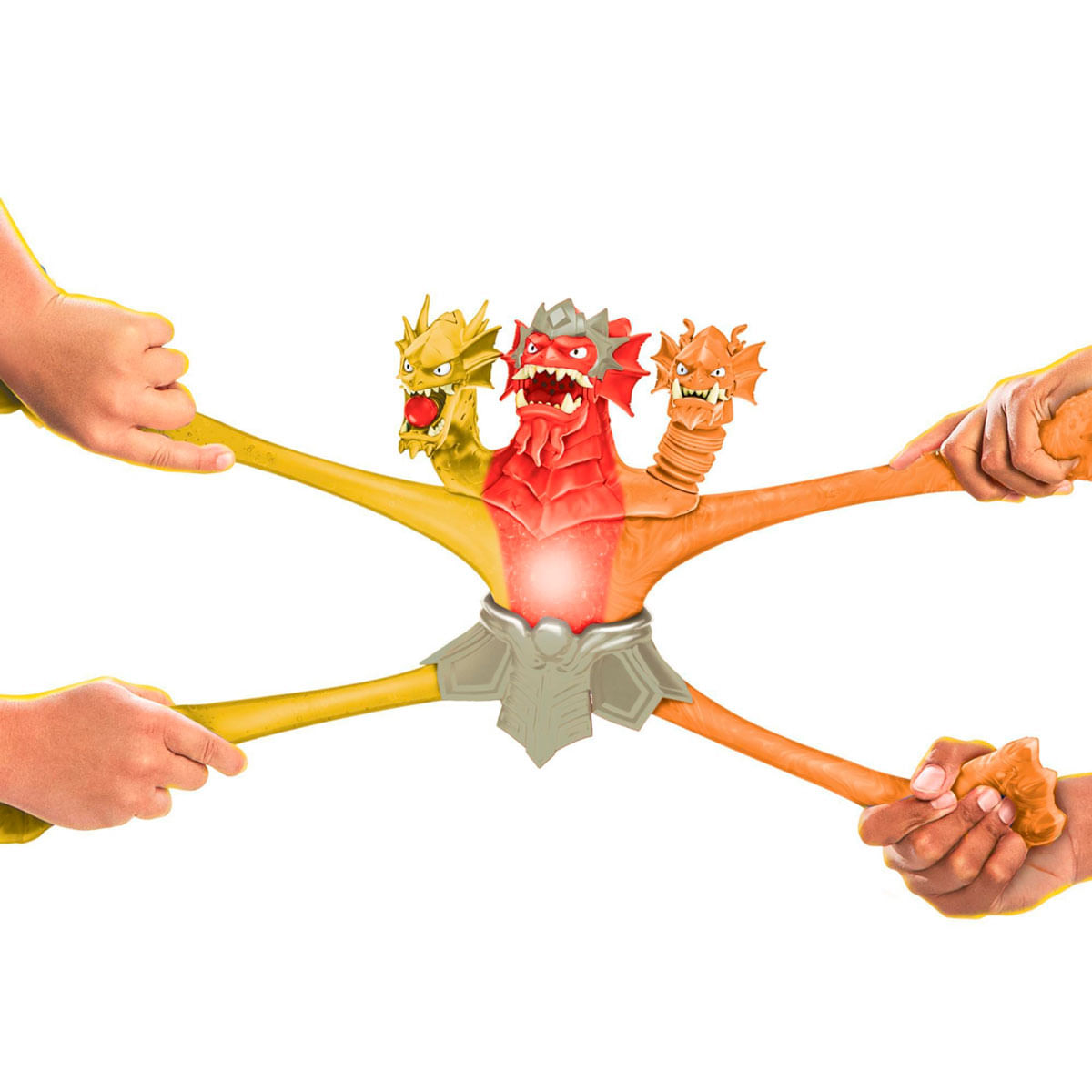 Un juguete de dragón con múltiples cabezas es tirado por manos. El dragón es rojo, naranja y amarillo, con una placa pectoral plateada. Las manos estiran el juguete.