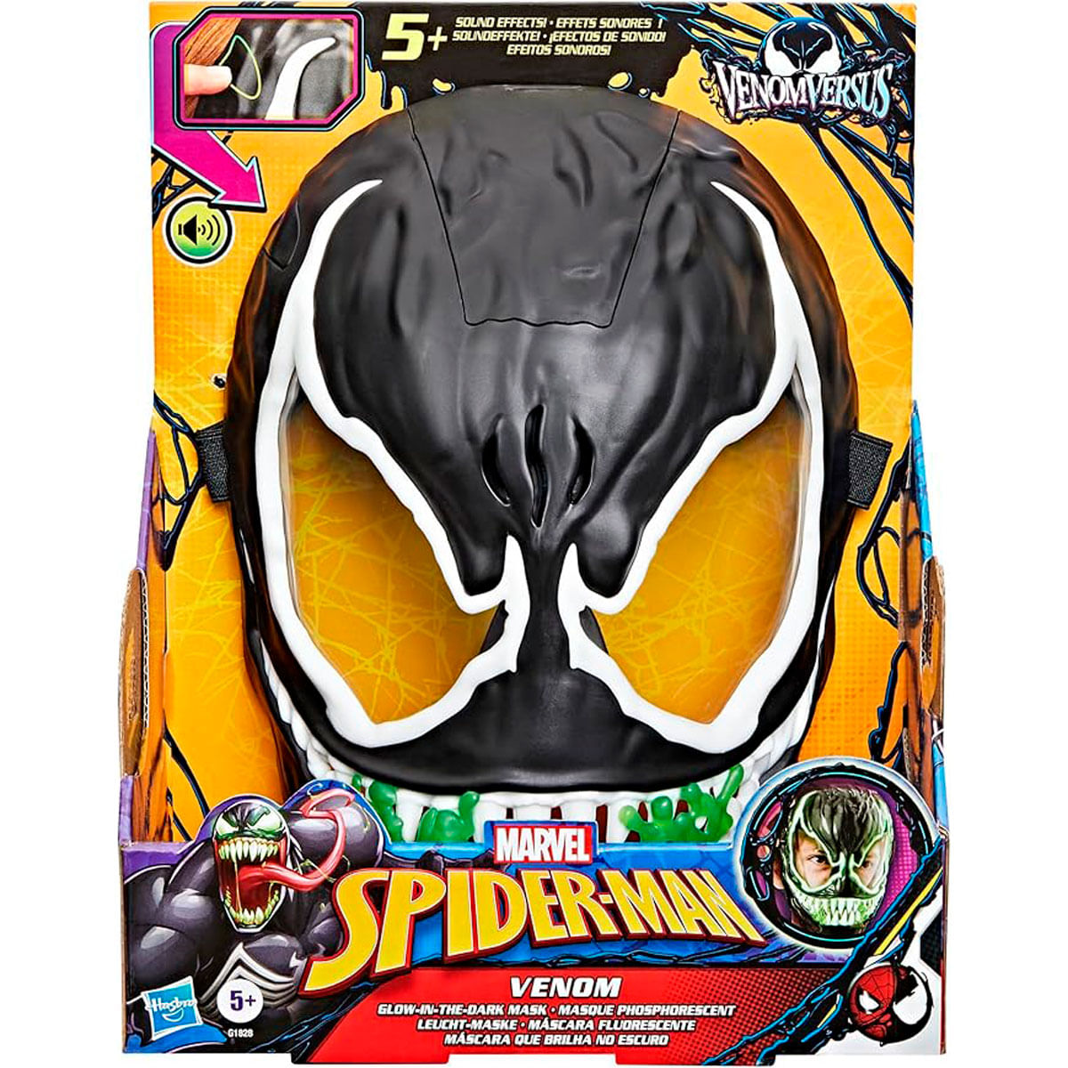 Máscara de Venom en una caja. Máscara negra con detalles blancos y ojos amarillos. Logos de Spider-Man y Venom visibles.