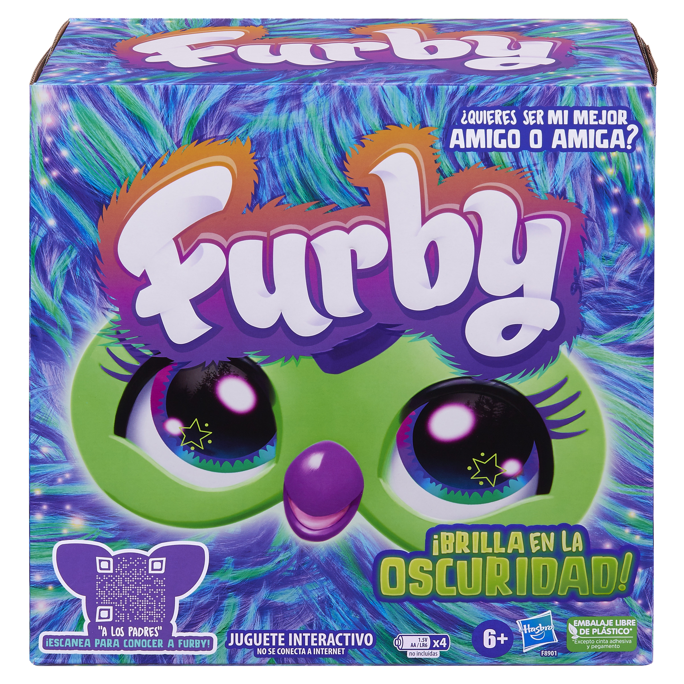 Caja de juguetes Furby con cara verde, nariz morada y ojos grandes. El texto dice "Furby" y "¡Brilla en la oscuridad!"