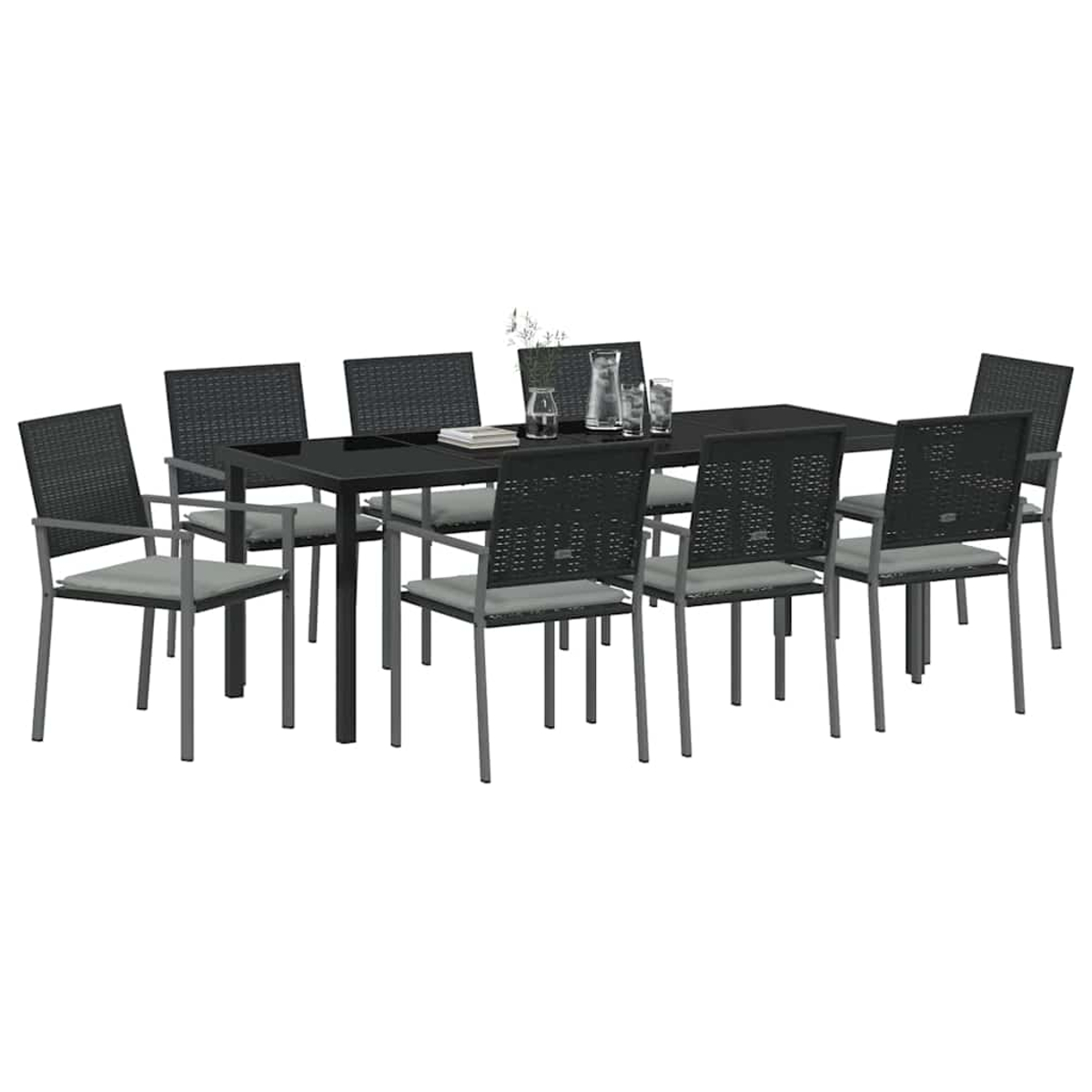Ein schwarzer rechteckiger Tisch mit acht Stühlen. Stühle haben graue Kissen und schwarze gewebte Rücken. Tisch hat eine Glasplatte mit Gläsern.