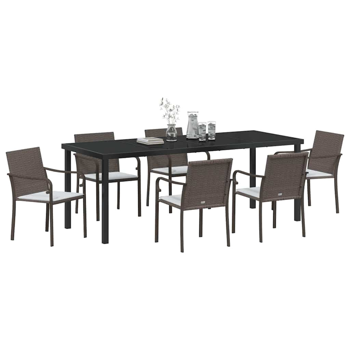 Essgruppe mit schwarzem Tisch und sechs Stühlen. Wasserkrug, Gläser und Dekorationsartikel stehen auf dem Tisch.