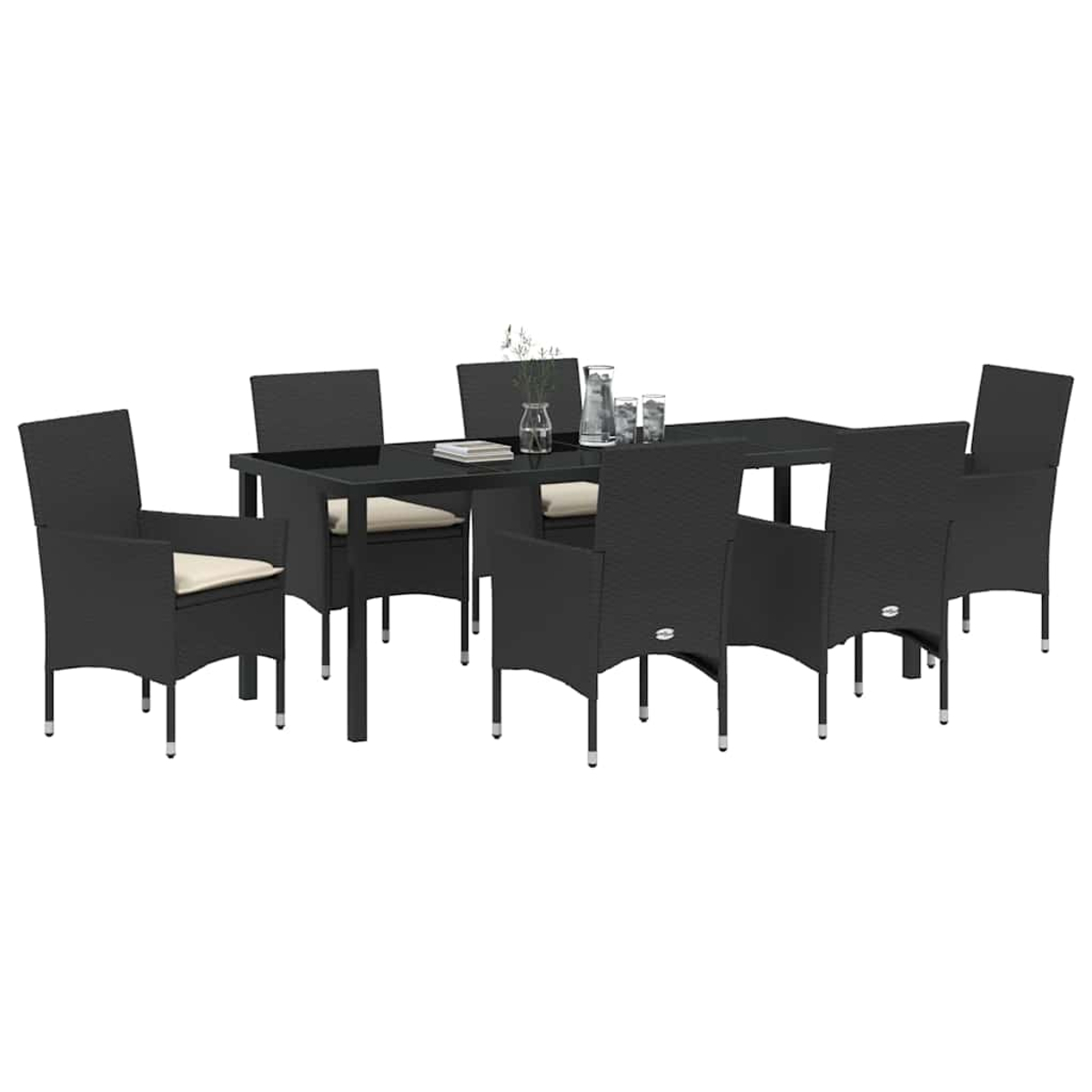 Un juego de comedor negro para exteriores con una mesa rectangular y seis sillas con cojines beige. Un jarrón, vasos y libros están sobre la mesa.