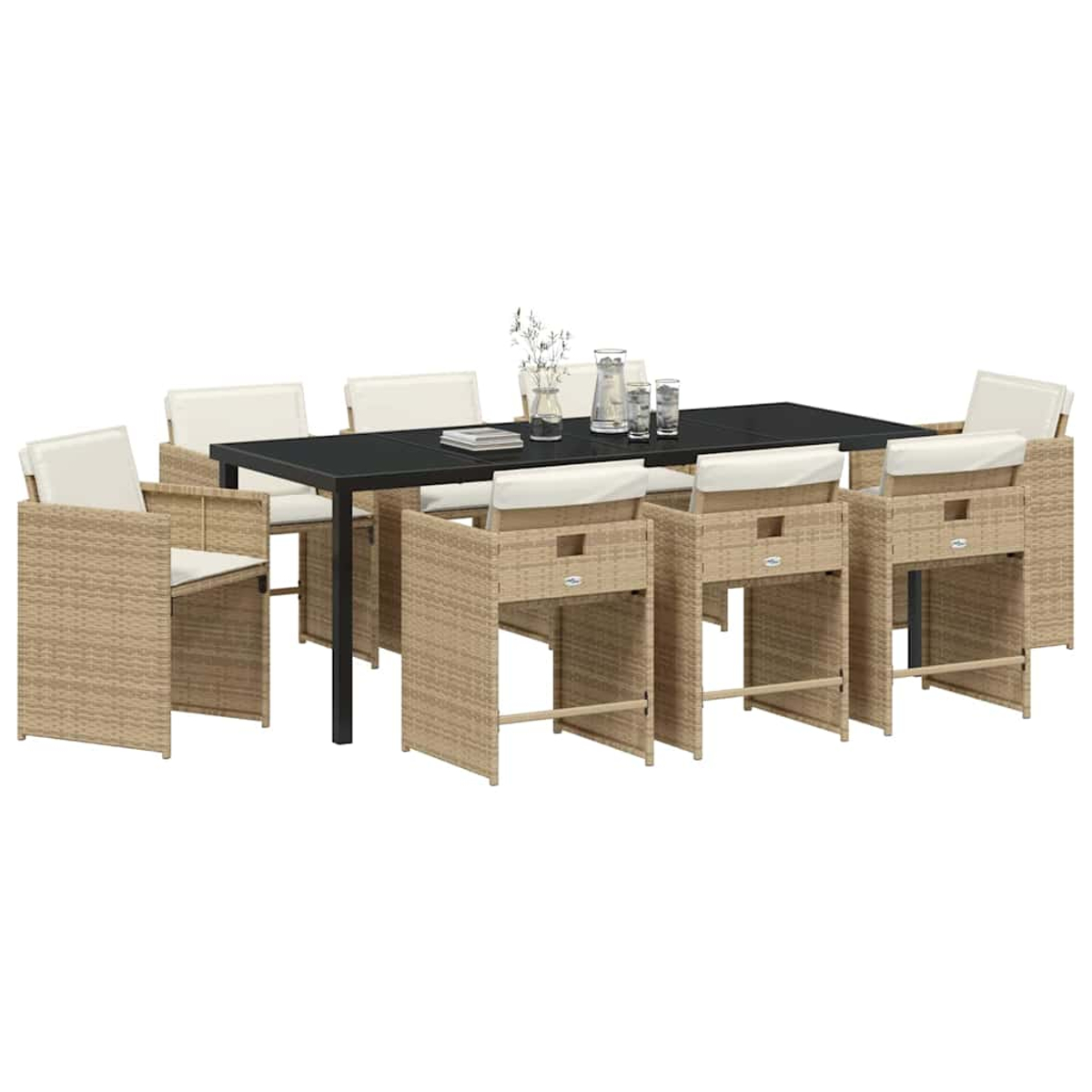 Set da pranzo all'aperto con tavolo nero, otto sedie in tessuto con cuscini bianchi e vetreria. Dominano i toni beige.