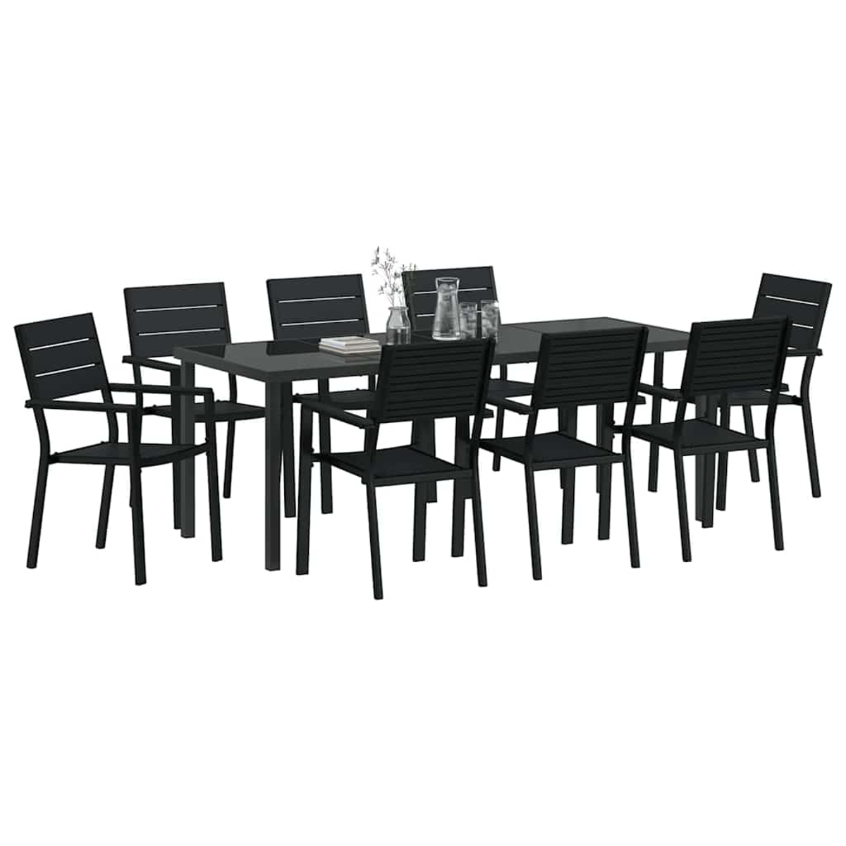 Ein schwarzes Esszimmer-Set. Rechteckiger Tisch mit acht Stühlen. Eine Vase mit Blumen und Trinkgläsern auf dem Tisch.