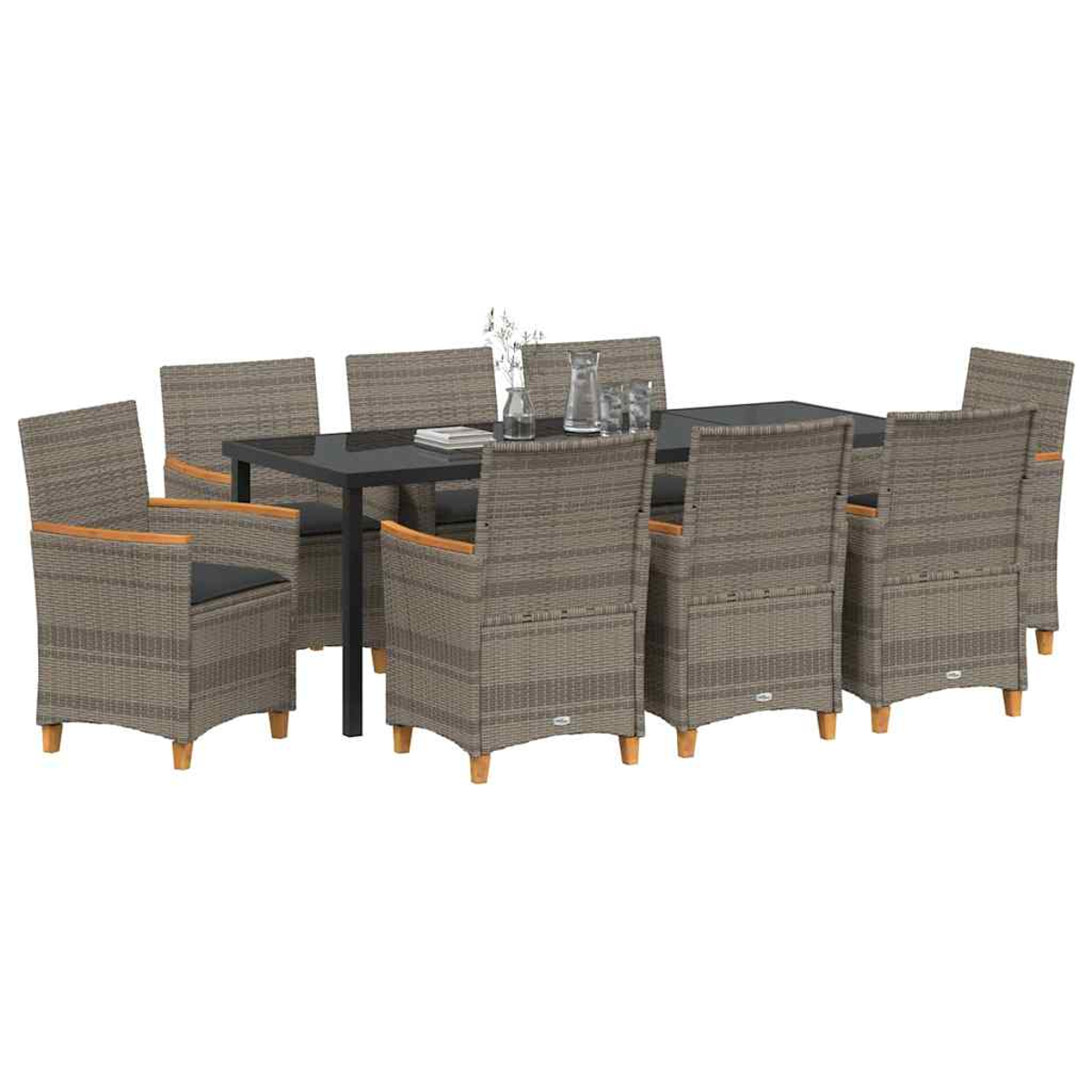 Essgruppe mit schwarzem Tisch und acht Korbstühlen. Auf dem Tisch stehen ein Glaskrug und Gläser.