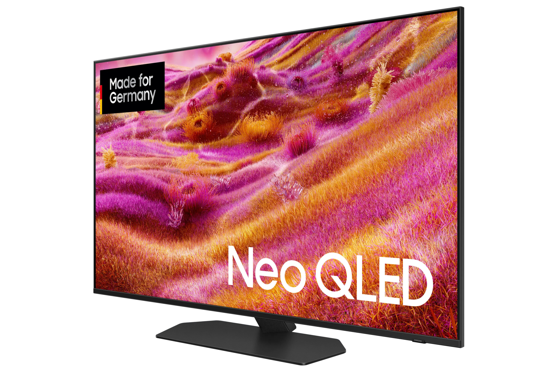Telewizor Neo QLED wyświetla kolorowe pole w odcieniach różu i żółci. Telewizor ma czarną ramkę i czarną podstawę. Made for Germany.