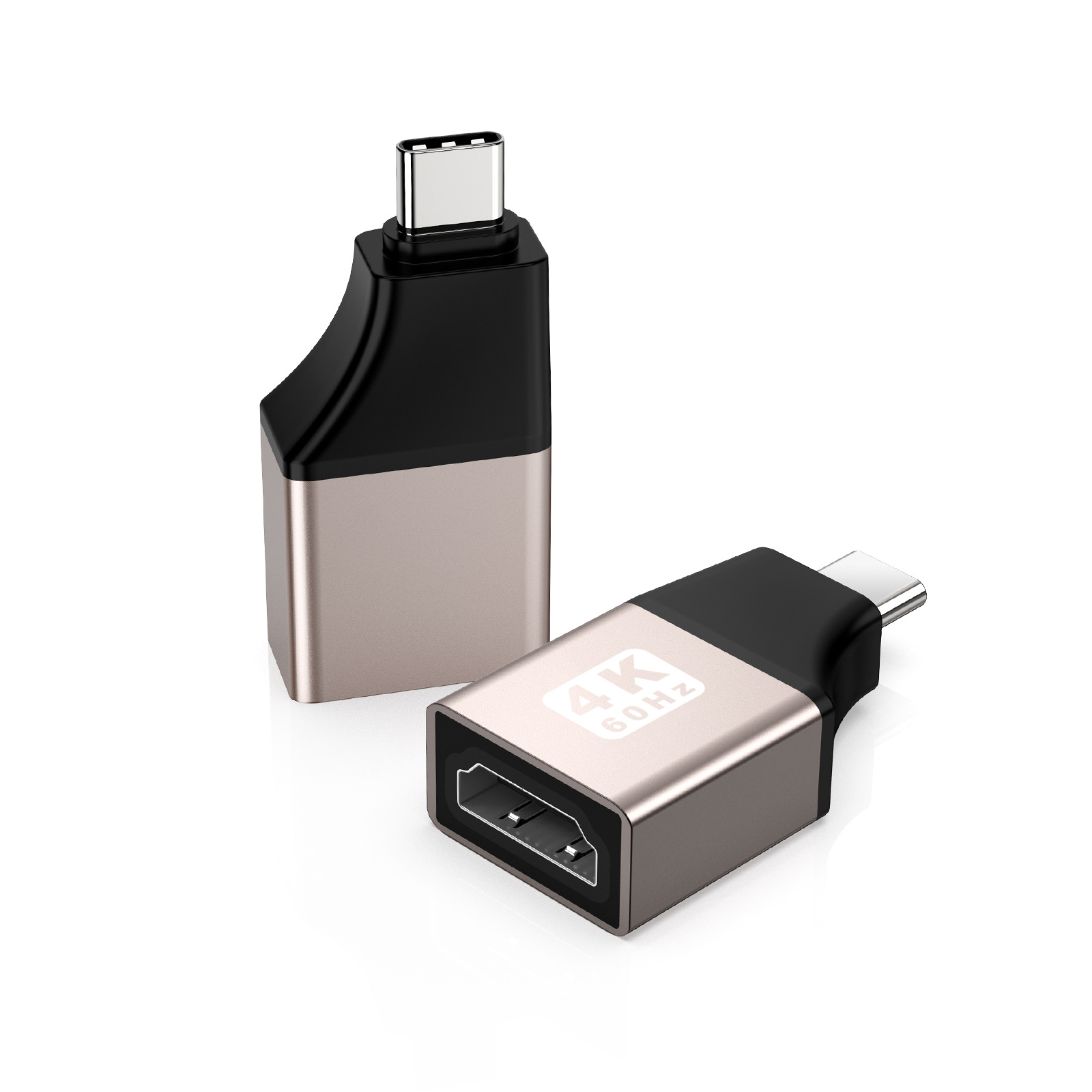Dwa srebrno-czarne adaptery USB-C na HDMI na białej powierzchni. Jeden stoi pionowo, drugi pod kątem.