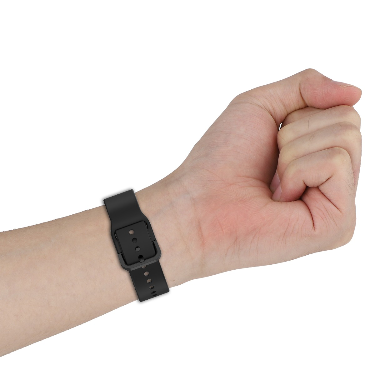 Eine Hand mit einer schwarzen Uhr. Die Hand ist zu einer Faust geballt. Das Uhrenarmband ist befestigt.