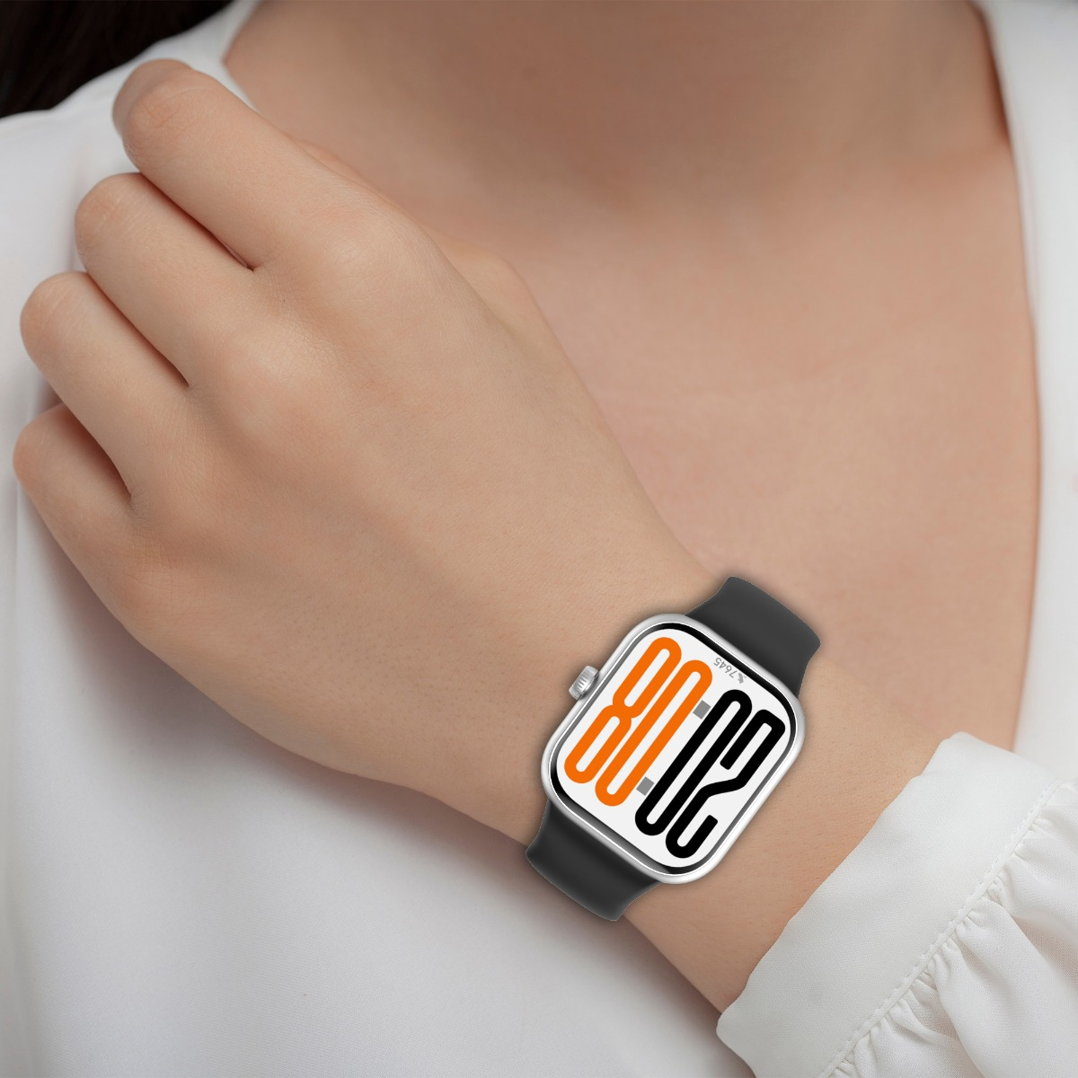 Eine Person trägt eine Uhr mit schwarzem Band, das Zifferblatt zeigt orange und schwarze Zahlen auf weißem Grund.