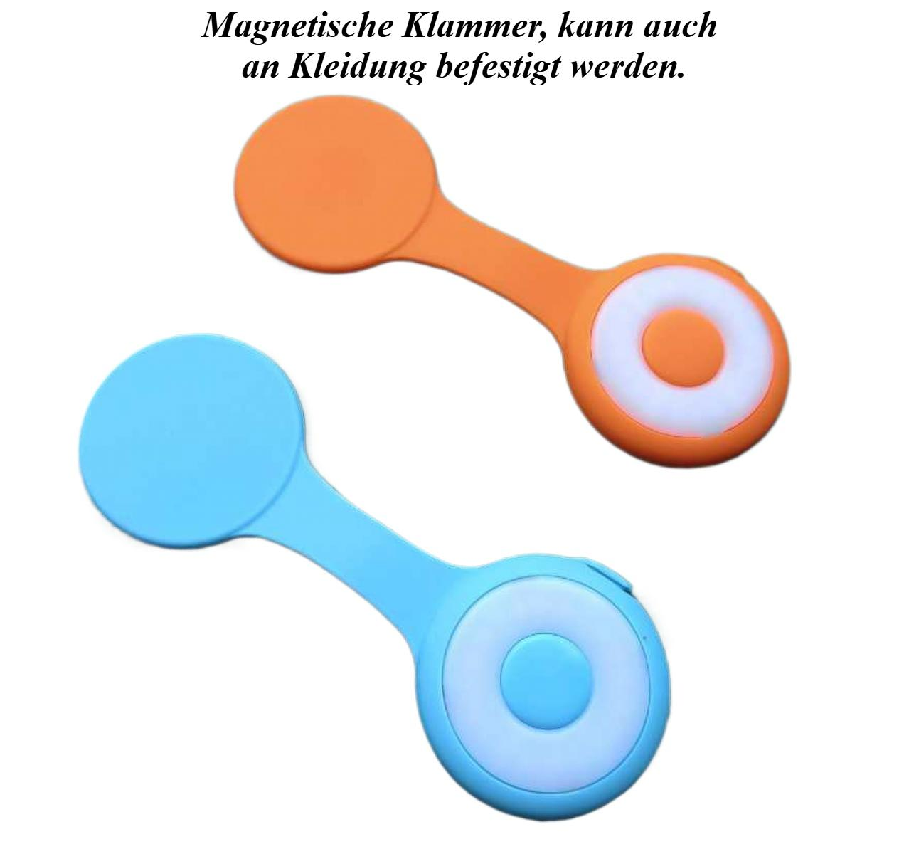 Zwei Magnetclips, einer orange und einer blau. Jeder hat einen kreisförmigen Kopf und eine kreisförmige Mitte mit weißem Ring.