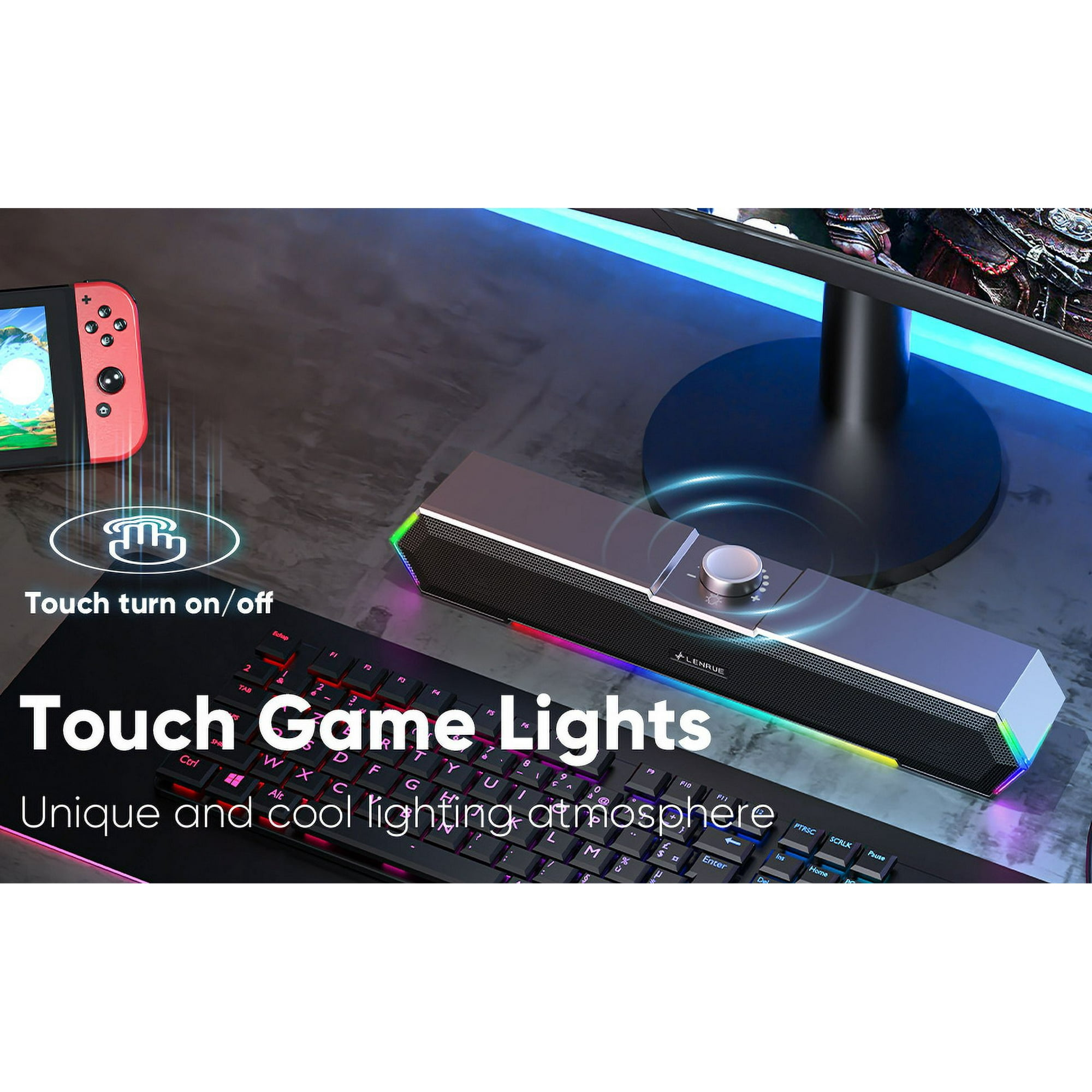 Ein Gaming-Setup mit Tastatur, Lautsprecher und Monitor. Links ein roter Gamecontroller. Text: 'Touch Game Lights'.