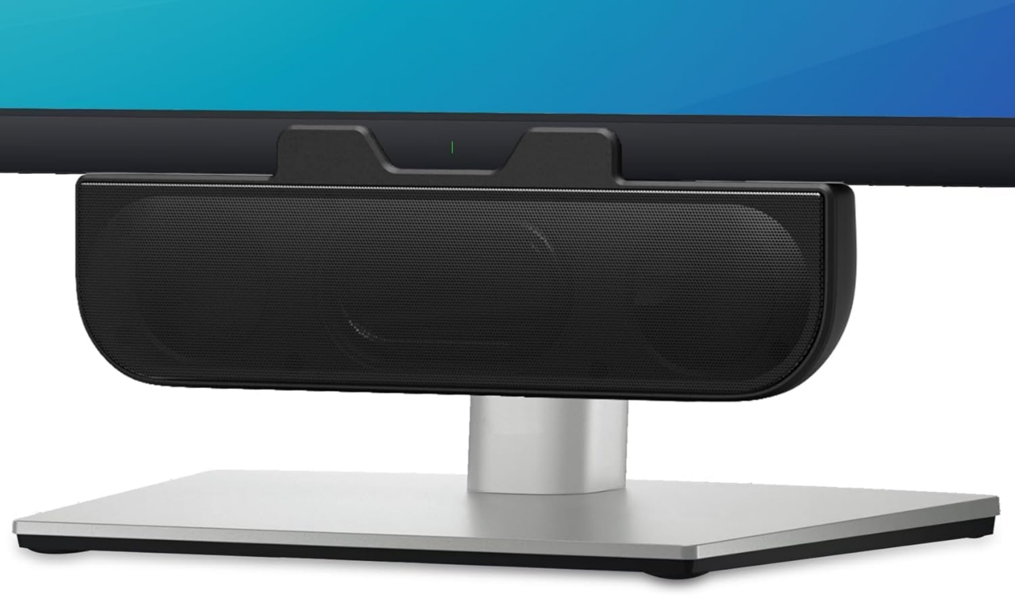 Ein schwarzer Lautsprecher ist auf einem Monitorständer montiert. Der Monitor hat einen blauen Bildschirm. Der Ständer ist silber.