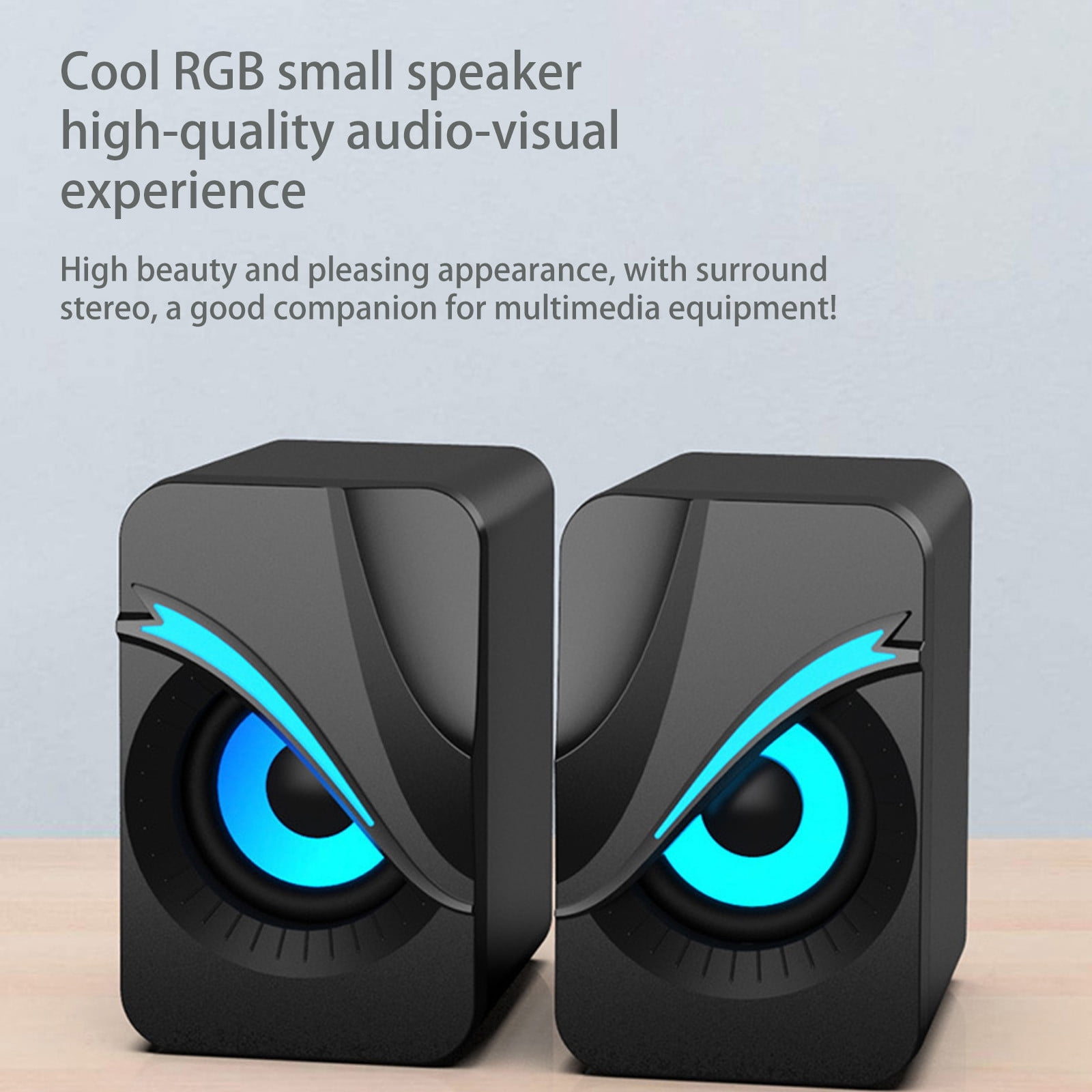 Zwei schwarze Lautsprecher mit blau beleuchteten Kreisen. Text: Cooler RGB-Lautsprecher. Hohe Schönheit und ansprechendes Aussehen.