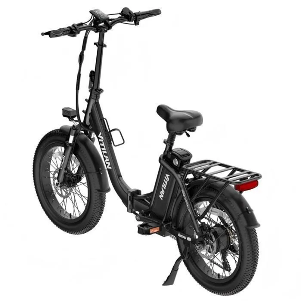 Bicicleta eléctrica negra. Incluye manillar, asiento, ruedas y portaequipajes. Visible la marca 'VITILAN'.