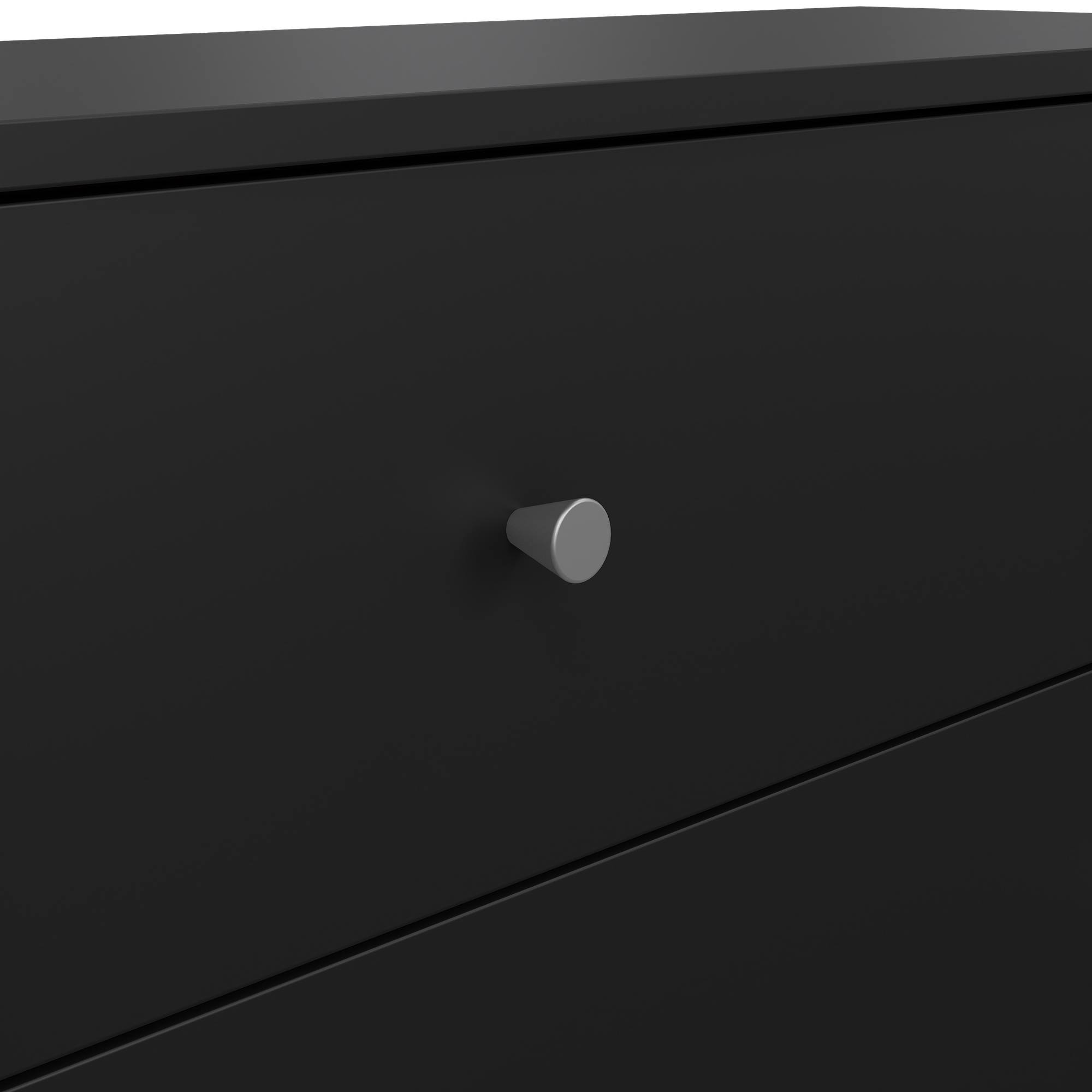 Primer plano de un cajón negro con un pomo plateado. El cajón está cerrado y tiene un diseño minimalista.