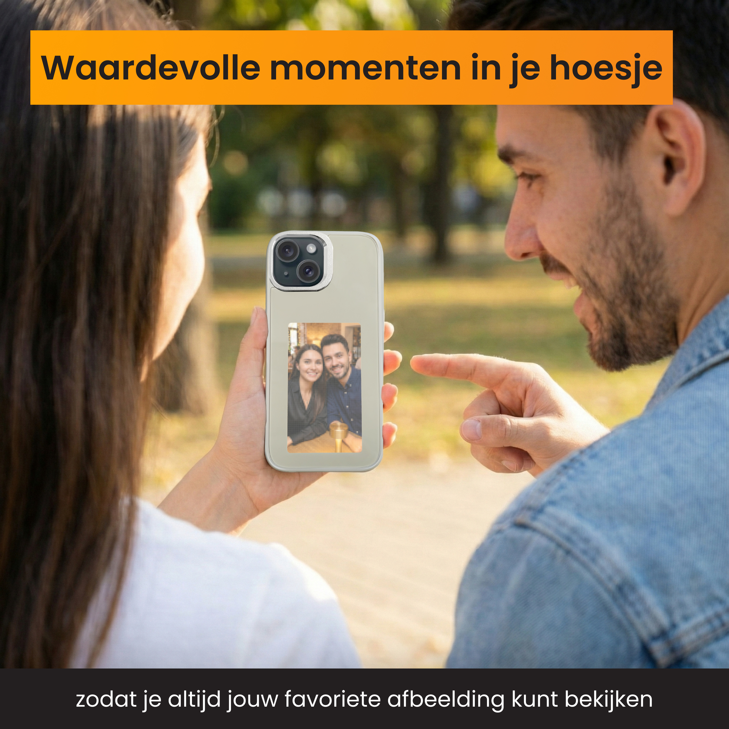A couple is holding a phone showing their picture. A man is pointing at the phone.