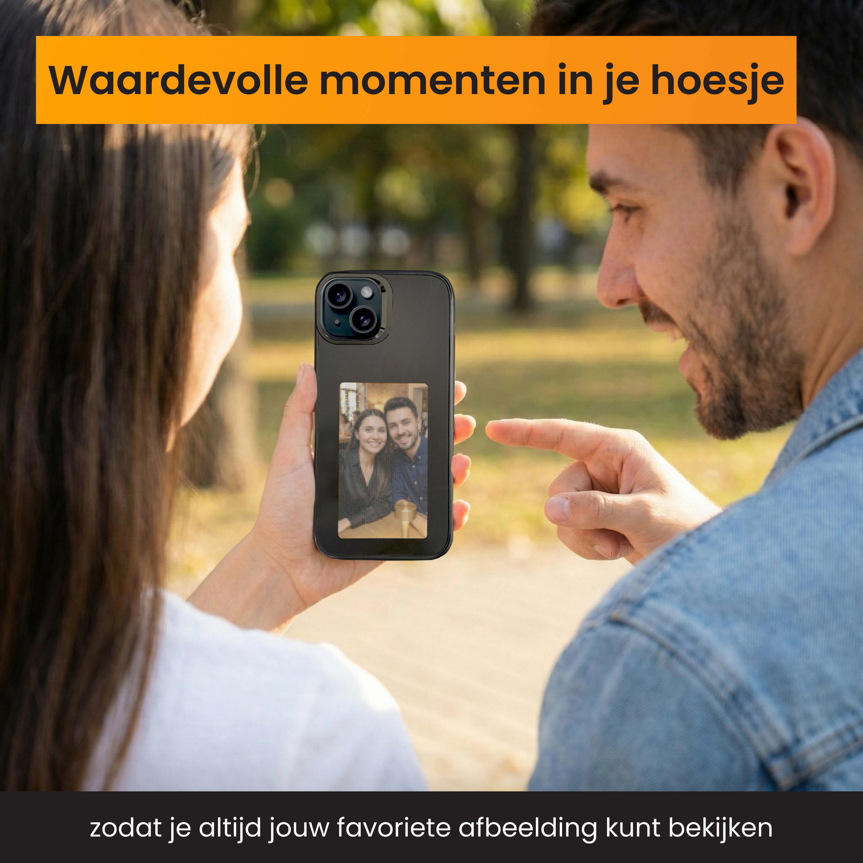A couple is looking at a phone showing a photo of themselves. A man points at the phone.