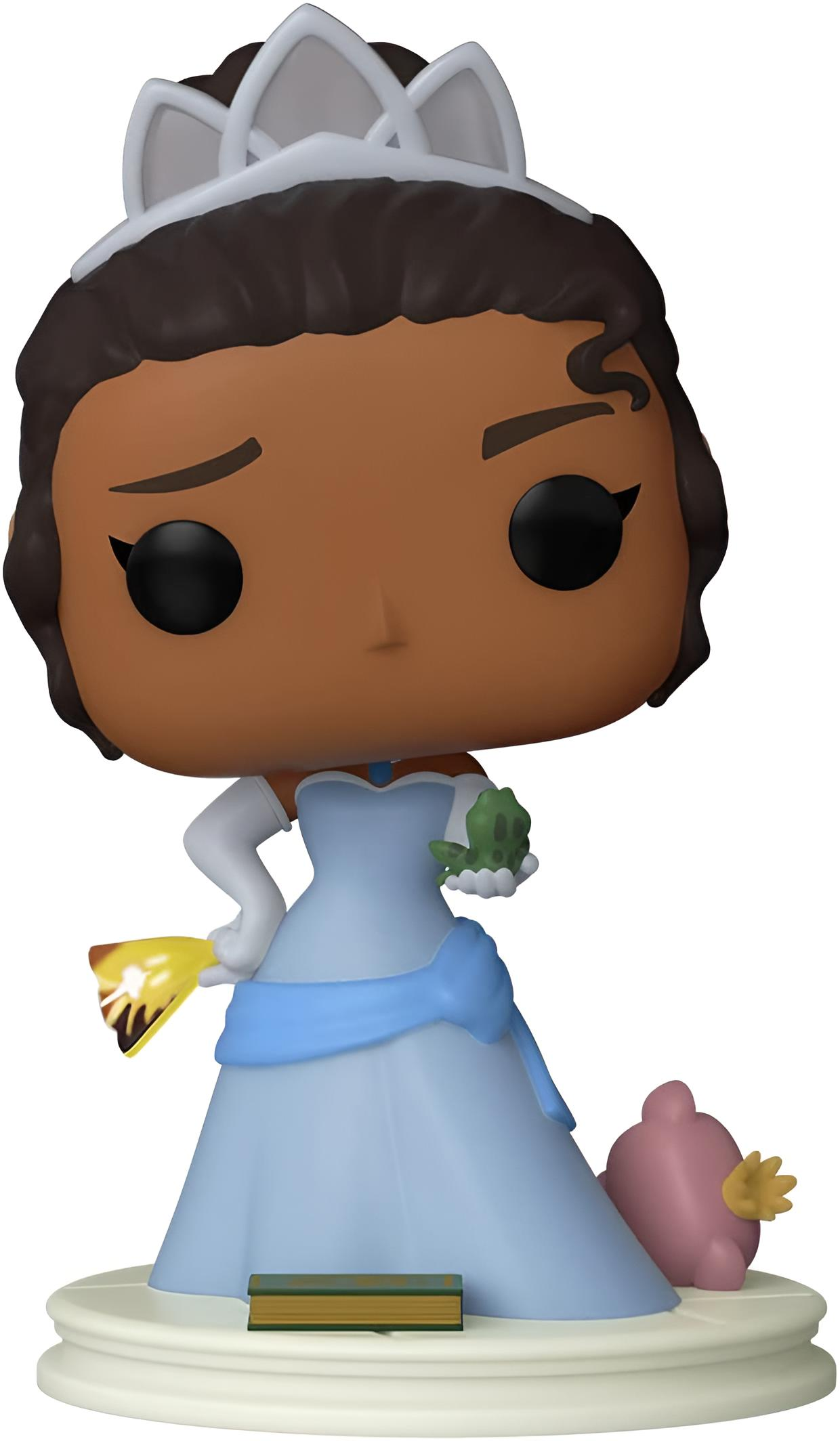 Prinzessinnenfigur in blauem Kleid, mit Frosch und goldenem Gegenstand. Eine rosa Figur und ein Buch sind ebenfalls vorhanden.