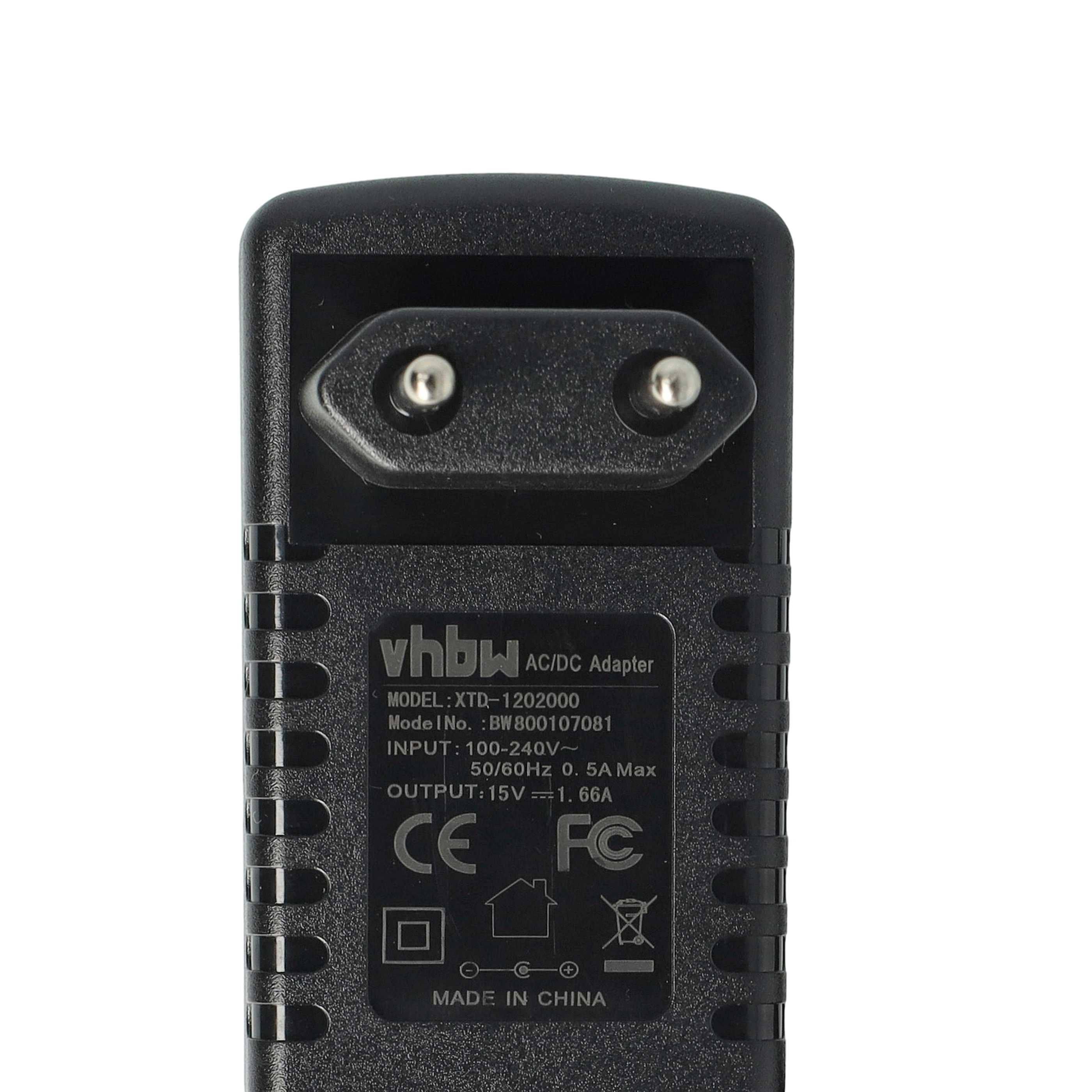 Ein schwarzer AC/DC-Adapter mit einem zweipoligen Stecker. Er hat weißen Text mit technischen Daten und Zertifizierungen.