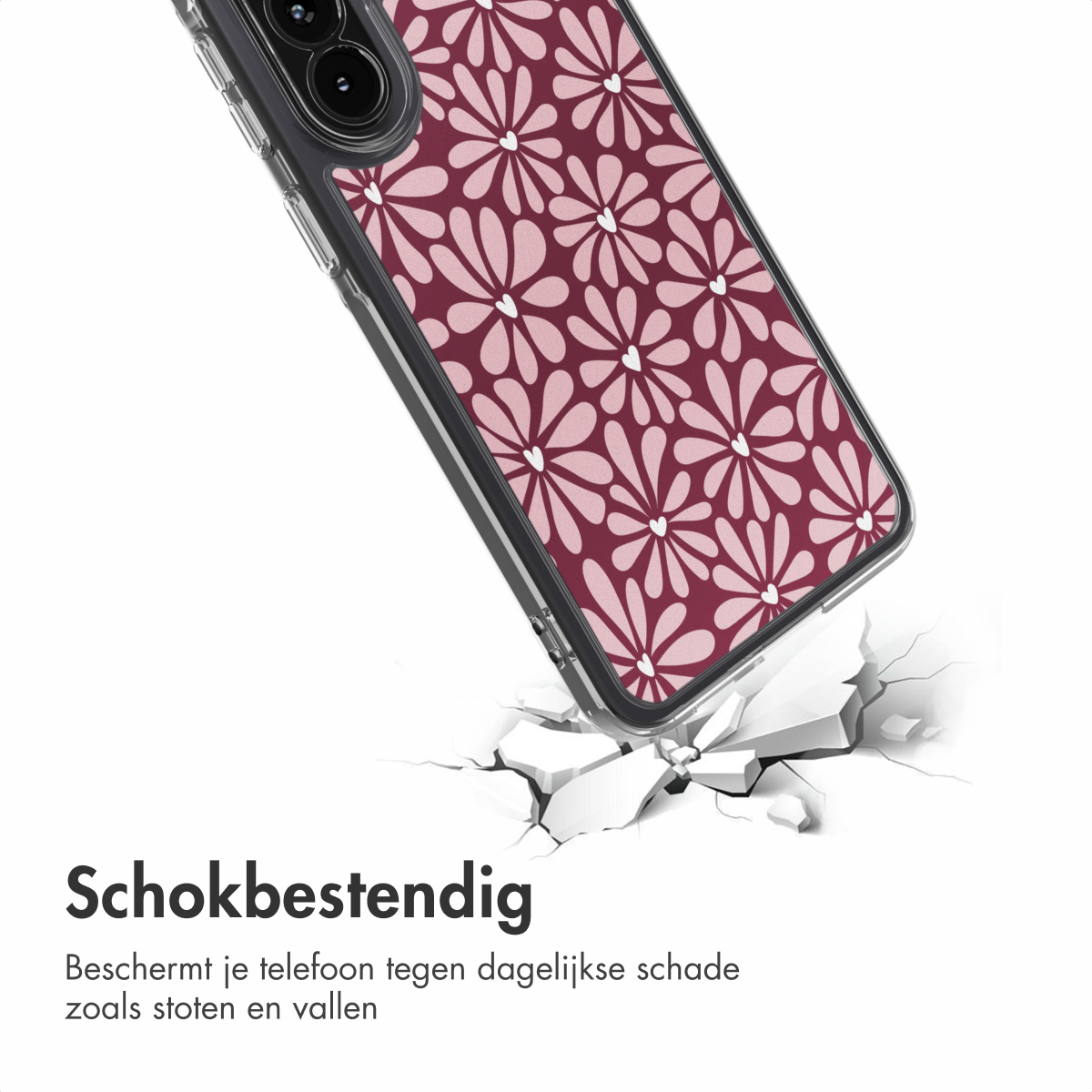 Una custodia per telefono con motivo floreale sta cadendo, incrinando il terreno sottostante. La custodia ha un telaio trasparente e un design floreale bordeaux.