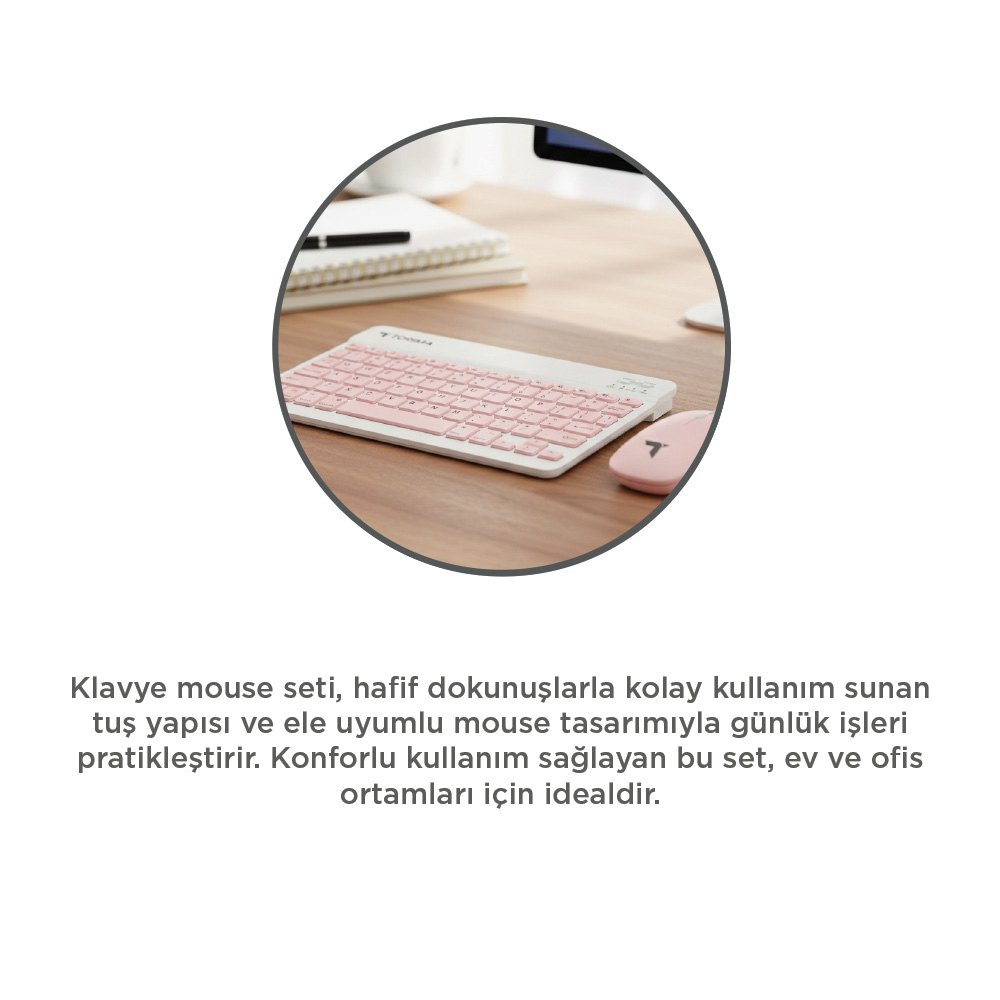 Yuvarlak bir çerçeve içinde, ahşap bir masanın üzerinde pembe bir klavye ve fare seti. Arka planda bir not defteri ve bir kalem var.