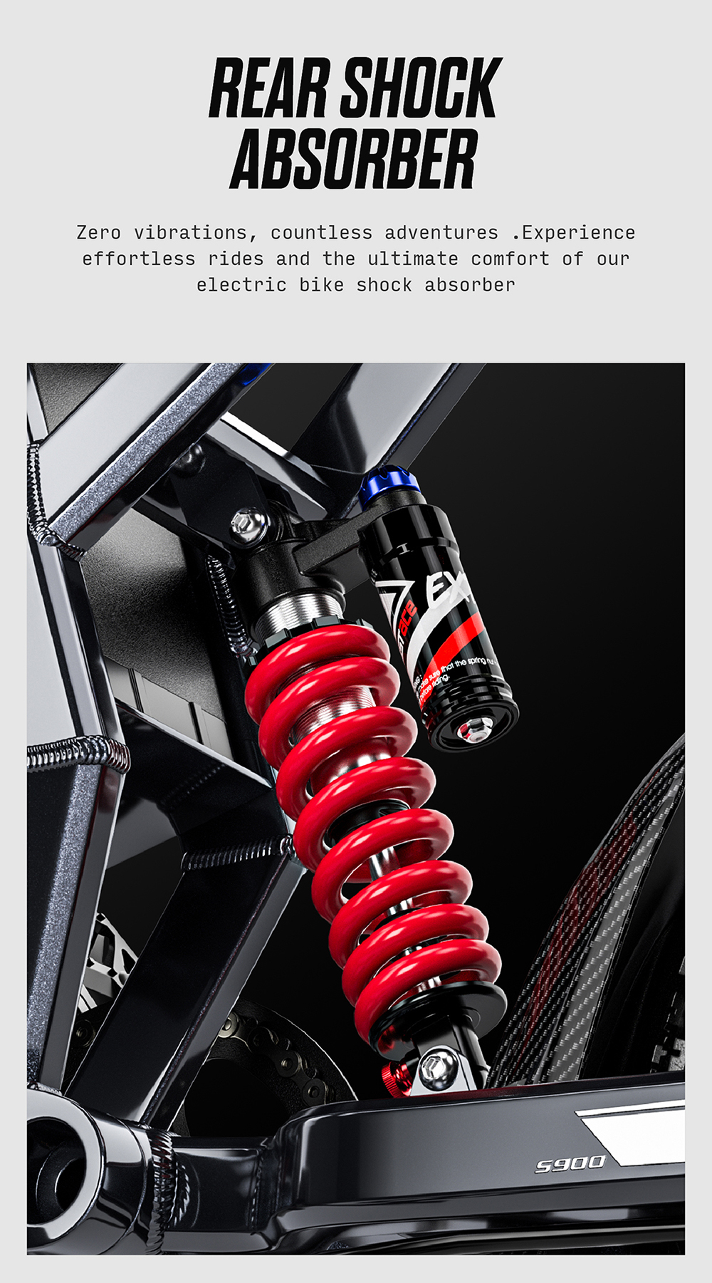 Primo piano di un ammortizzatore a molla rosso su una bici elettrica nera. Il testo recita: 'REAR SHOCK ABSORBER'.