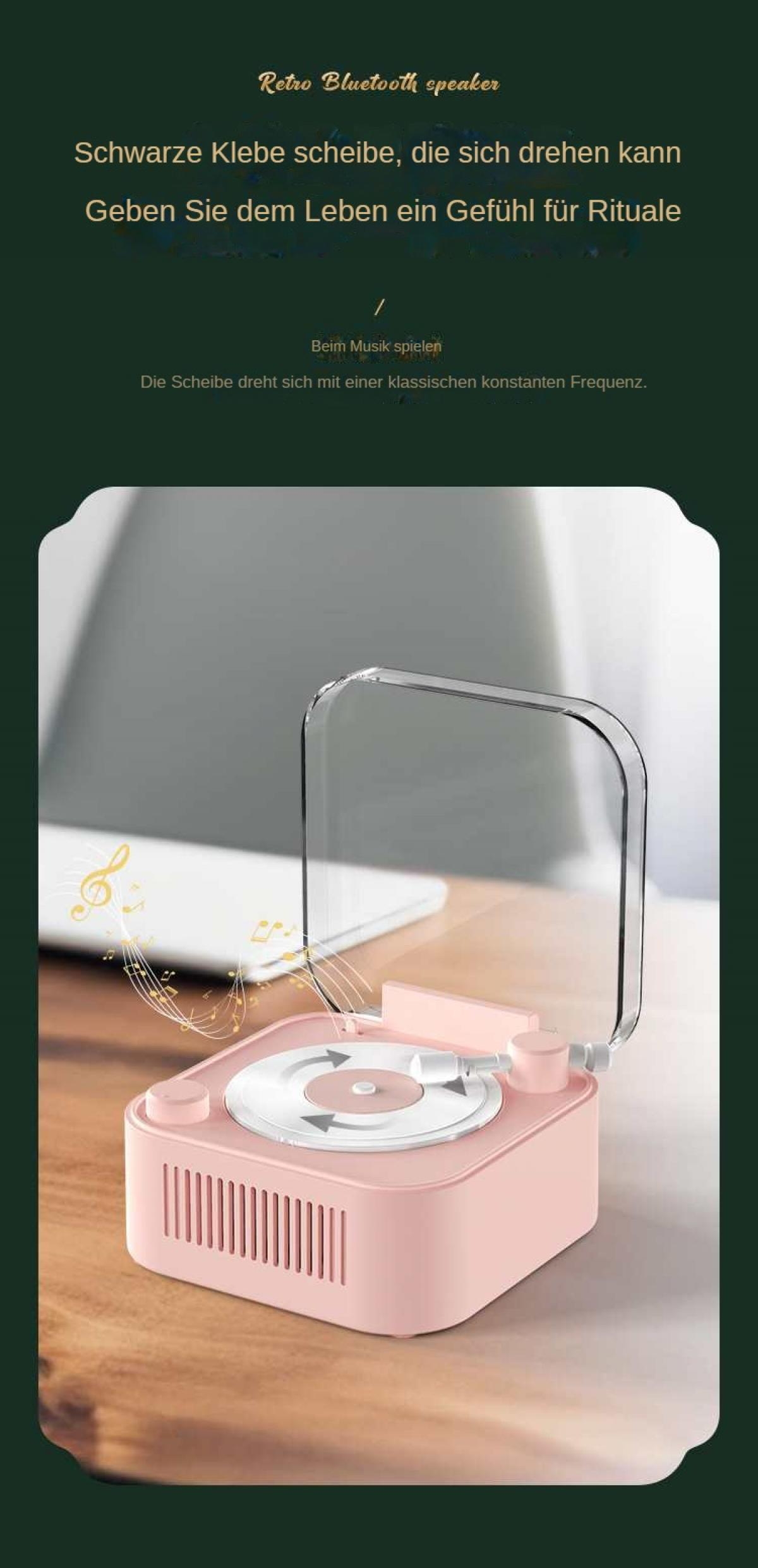 Ein rosa Retro-Bluetooth-Lautsprecher mit klarer Abdeckung. Eine Schallplatte liegt auf dem Player. Noten werden angezeigt.