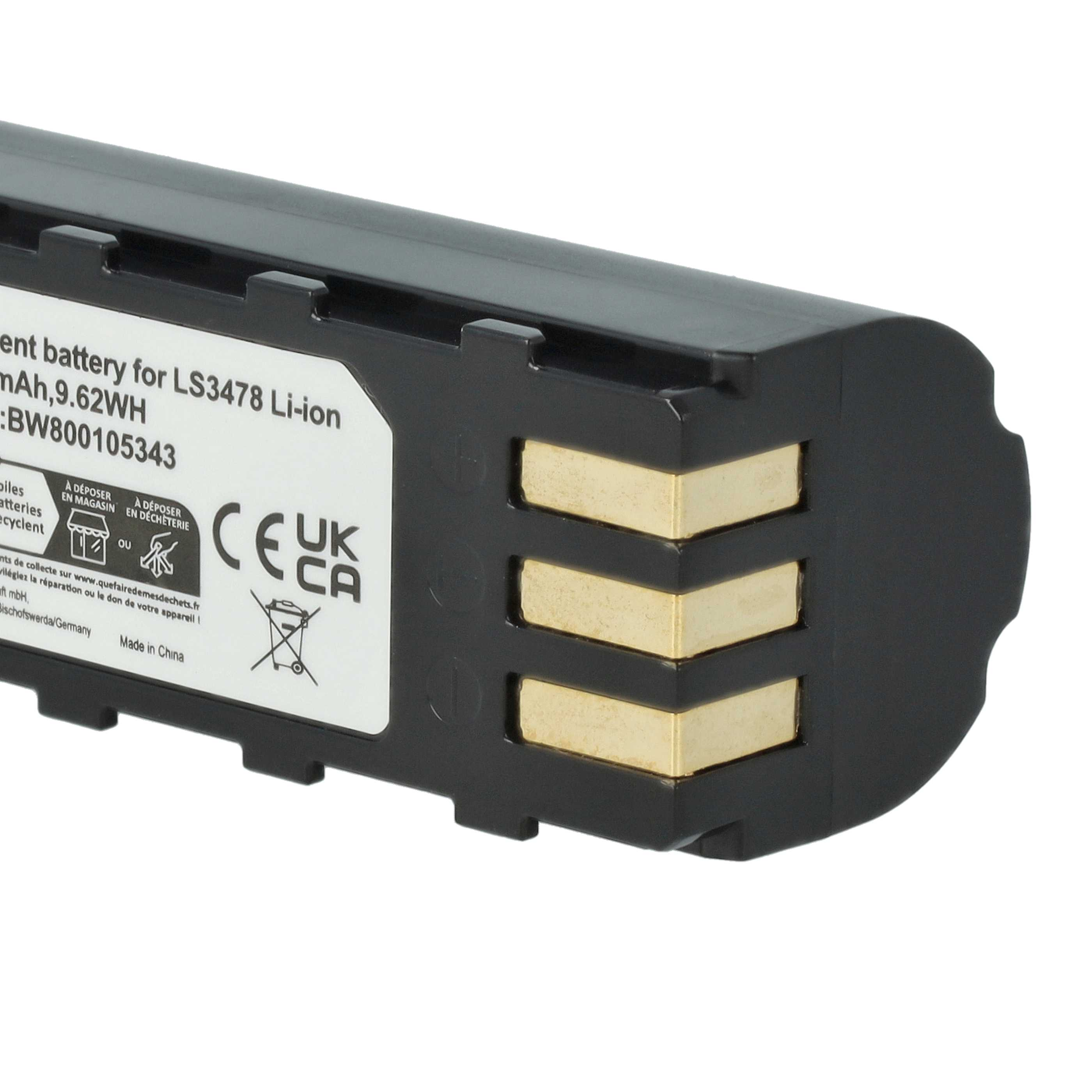 Nahaufnahme einer schwarzen Batterie mit goldenen Anschlüssen und einem weißen Etikett mit Text.