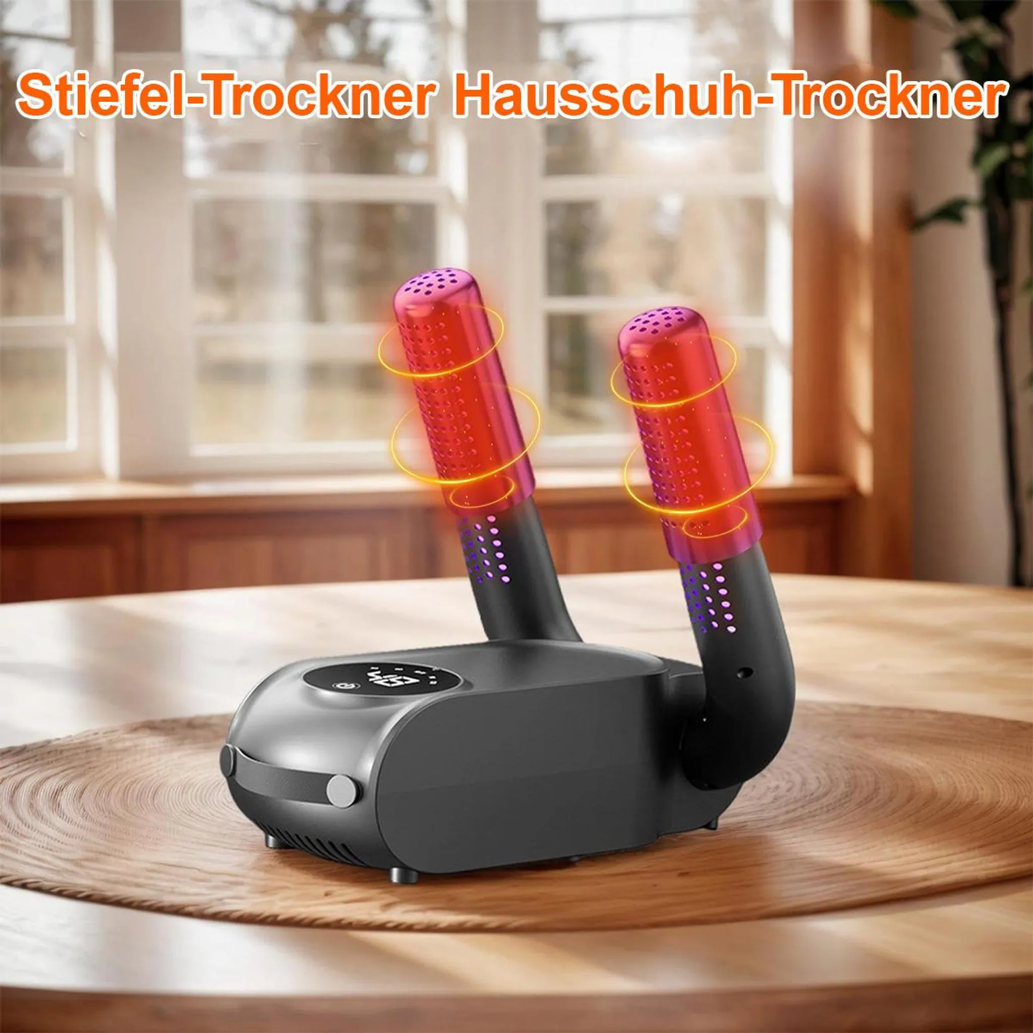 Ein Schuhtrockner mit zwei roten Trockenrohren. Er steht auf einem Holztisch. Der Hintergrund ist ein Fenster.