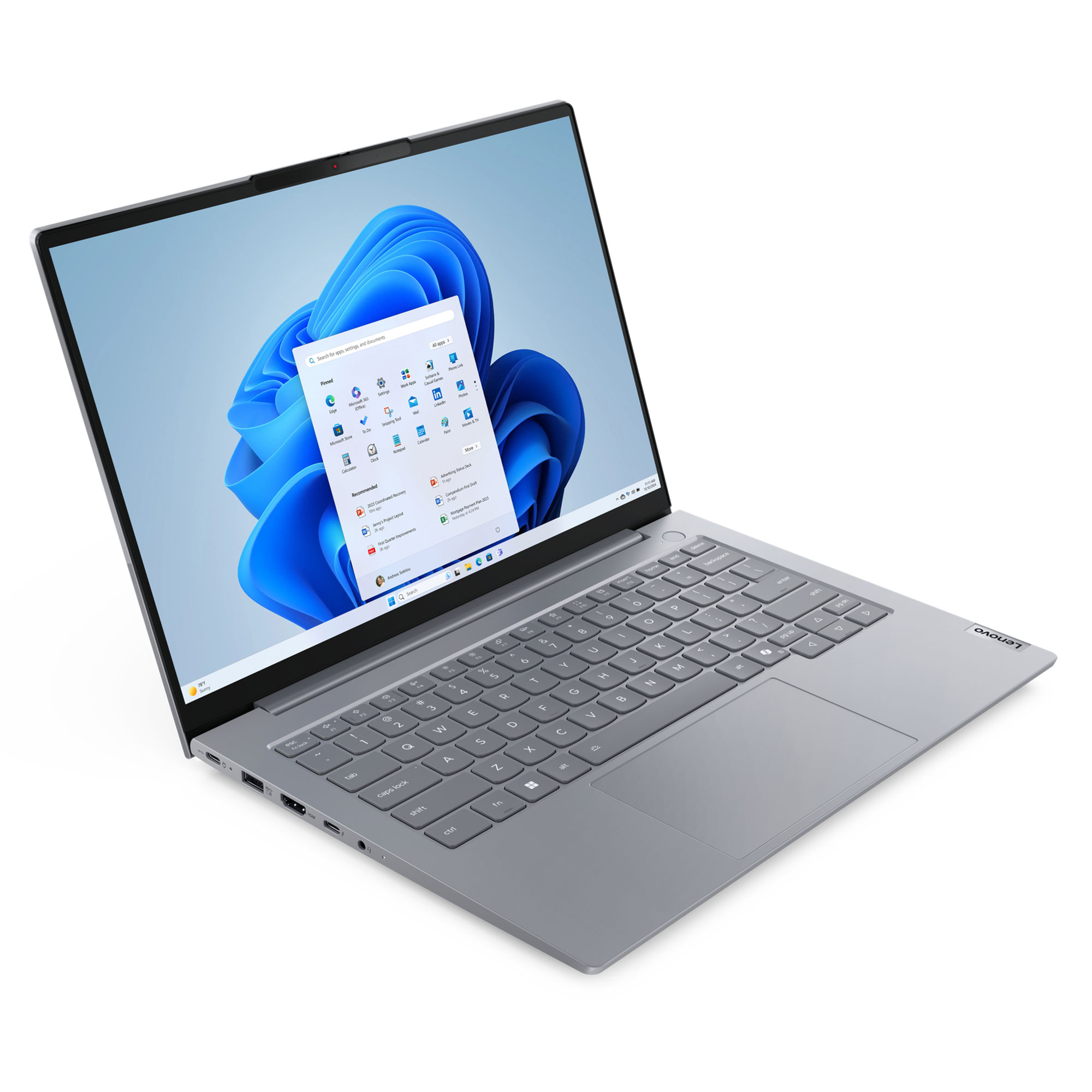 Gri bir Lenovo dizüstü bilgisayar açık, Windows 11 arayüzünü gösteriyor. Klavye ve dokunmatik yüzey görünür.